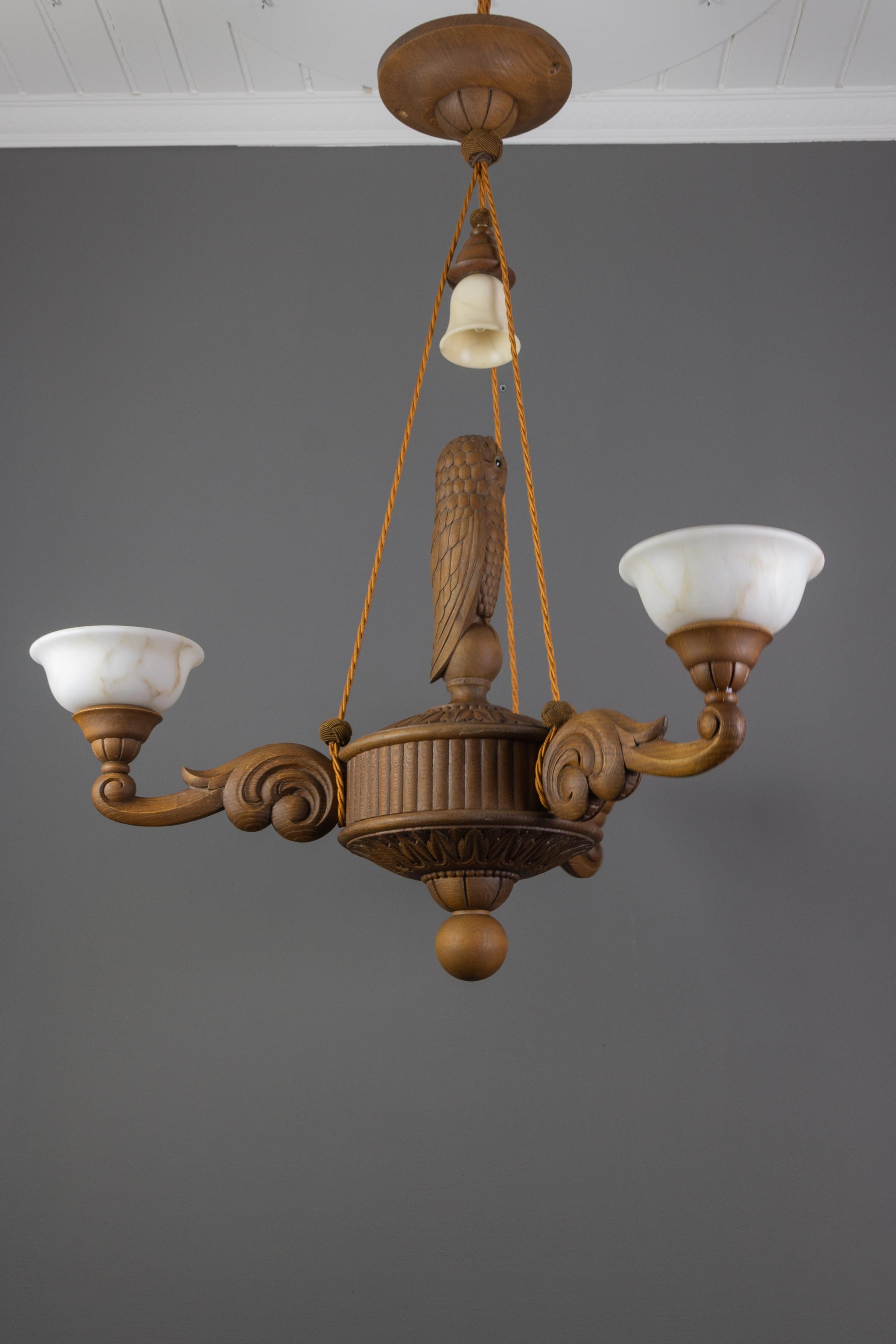 Hand-Carved Hand Carved Wooden and Alabaster Four-Light Chandelier with Owl Figure, Germany