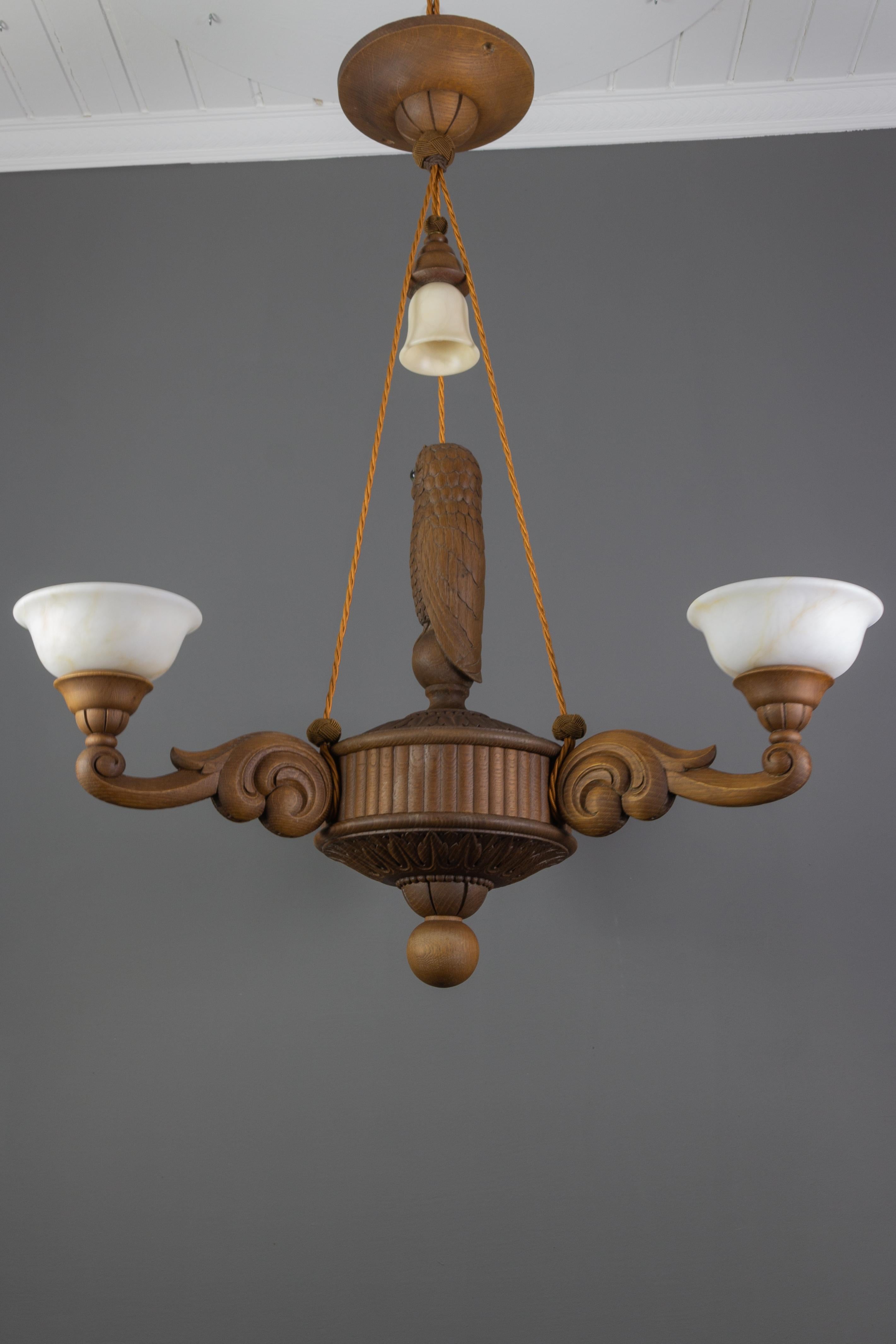 Hand Carved Wooden and Alabaster Four-Light Chandelier with Owl Figure, Germany 1