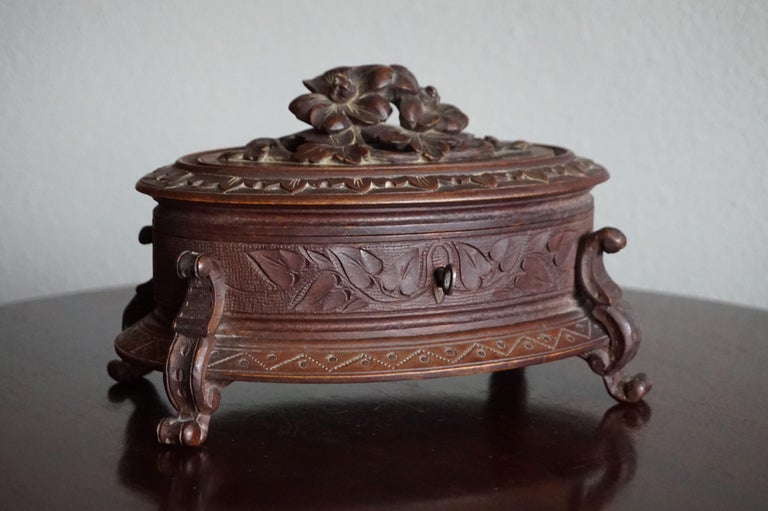 Beautifully designed and even better carved jewelry box.

If you are looking for a special gift for yourself or a loved one then this stylish box could be just that. This antique jewelry box perfectly shows how craftsman from the early 1900s were