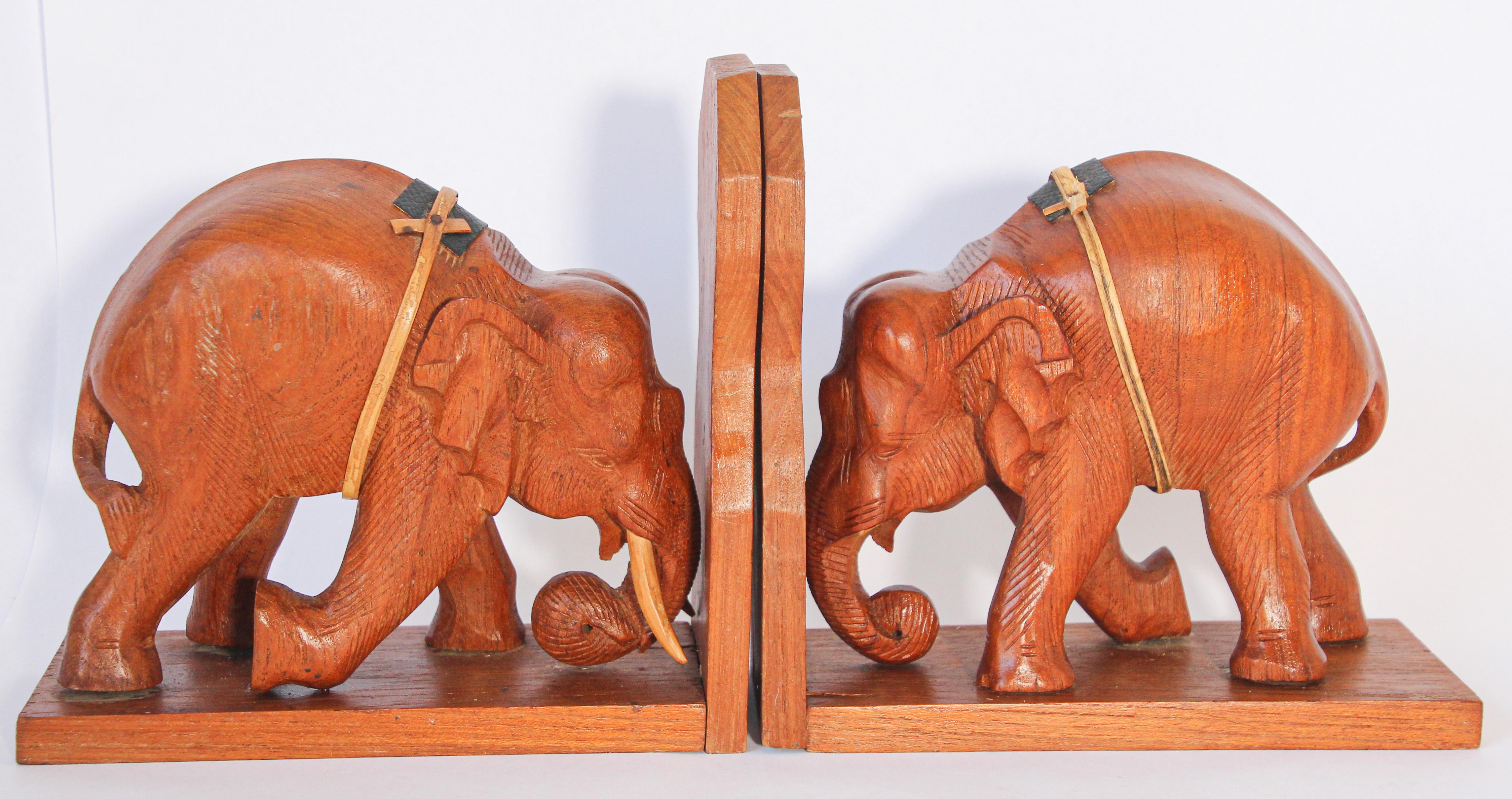 Nice pair of hand carved wooden Asian elephant bookends.
One of the elephant is missing his tusks.
Fine detailed hand carved elephant bookends with tusk down, for Asian this represent good health in Fen Shui.
These are hand carved and therefore