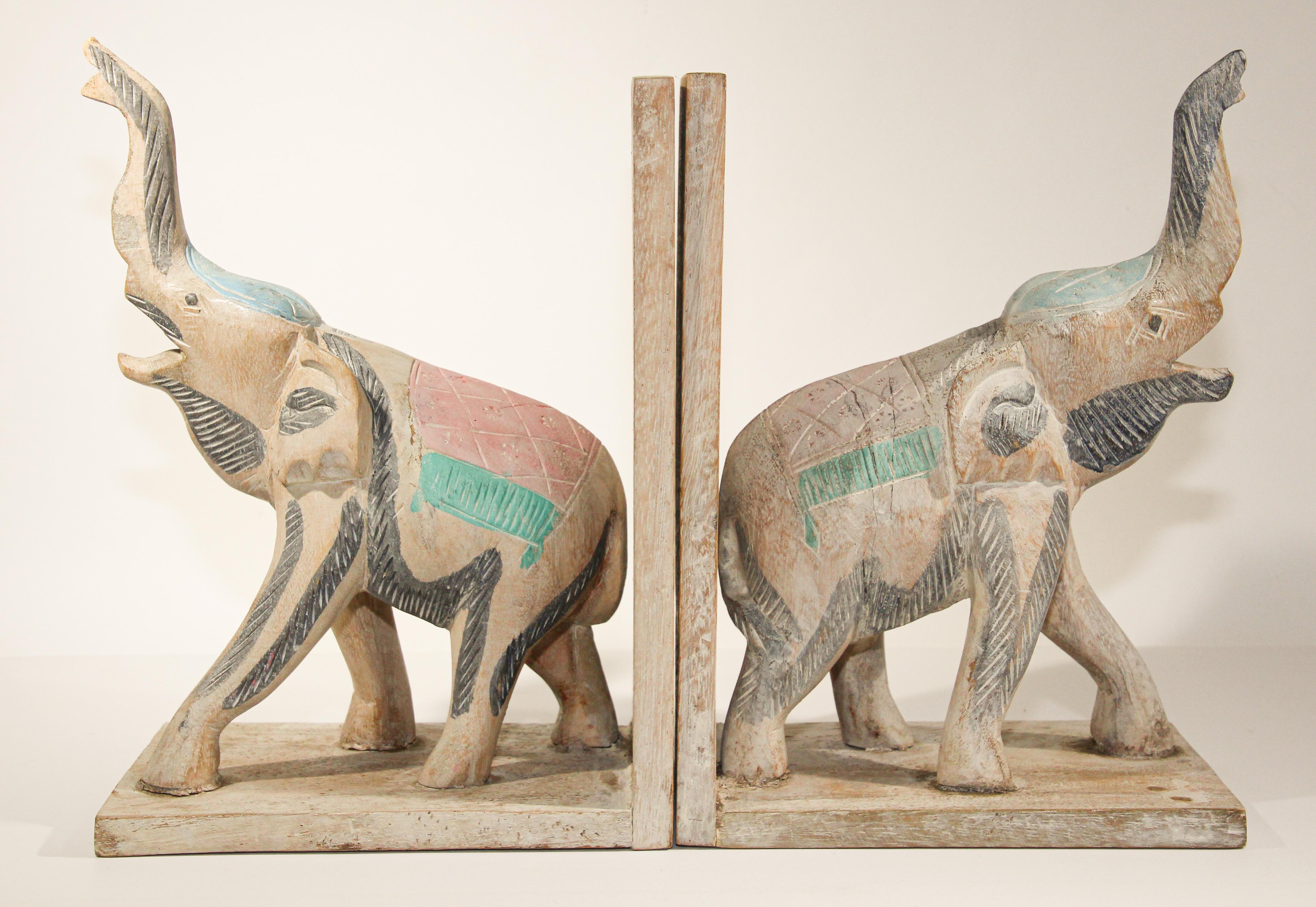 Nice pair of hand carved wooden Asian elephant bookends.
large Hand carved elephant bookends with trunk up, for Asian this represent good health in Fen Shui.
These are hand carved and hand painted therefore not completely identical,
circa
