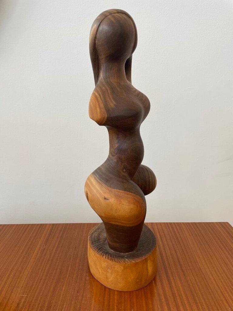 Hand Carved Wooden Female Form Bust signed on bottom by artist “ R. Blackstock”.