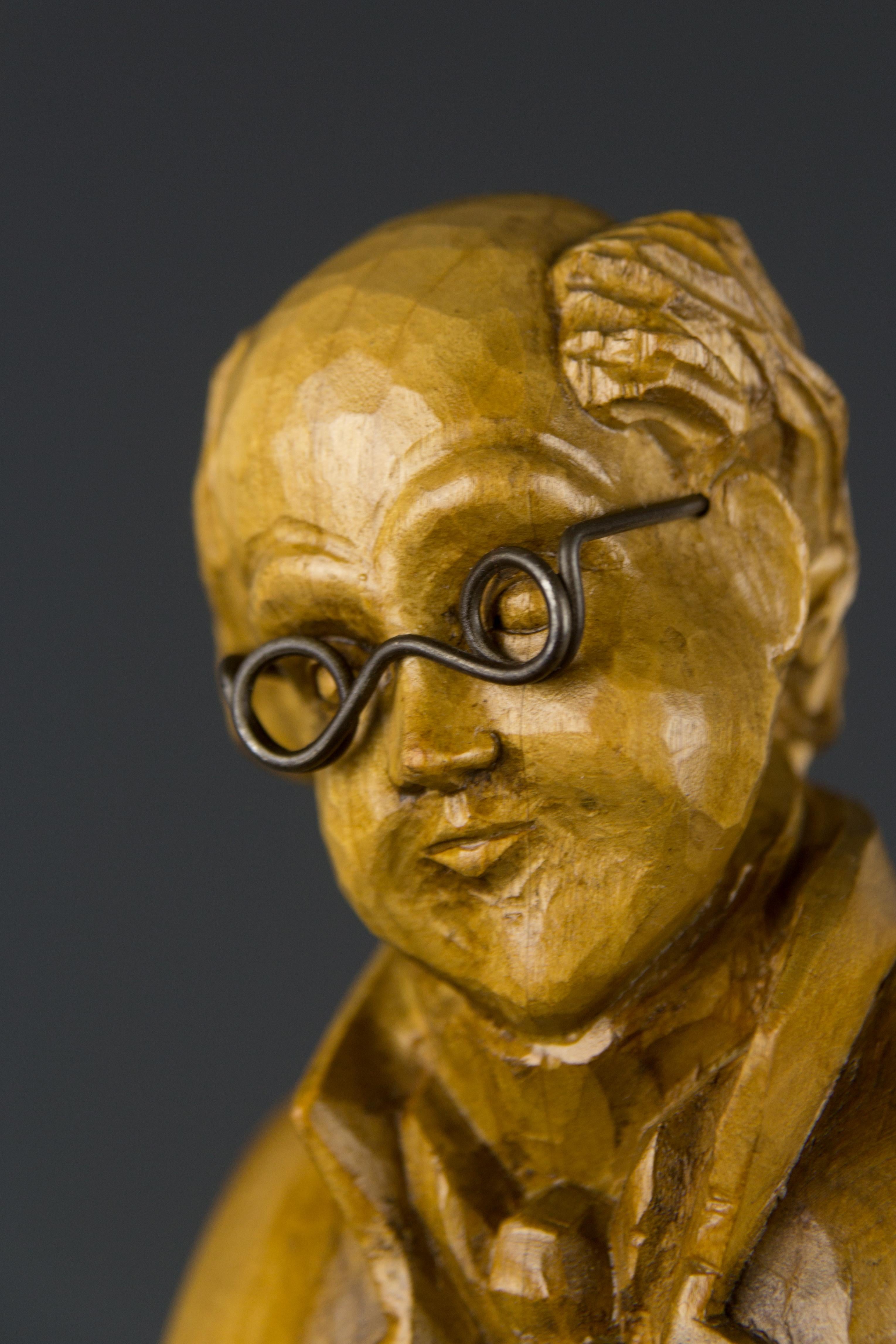 German Hand Carved Wooden Figurative Sculpture of a Professor with Books For Sale