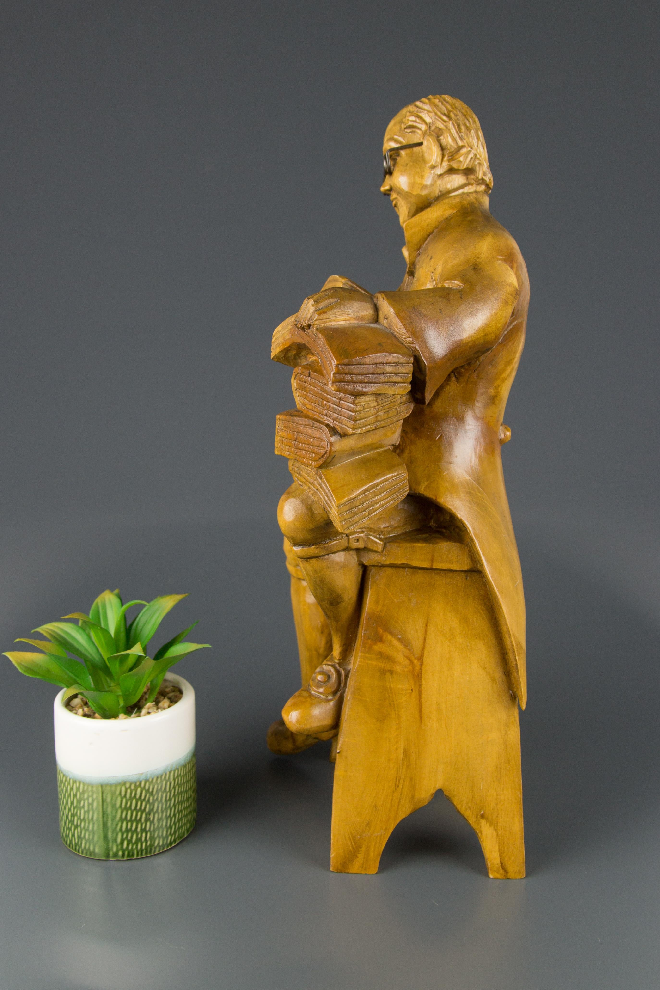 20th Century Hand Carved Wooden Figurative Sculpture of a Professor with Books For Sale