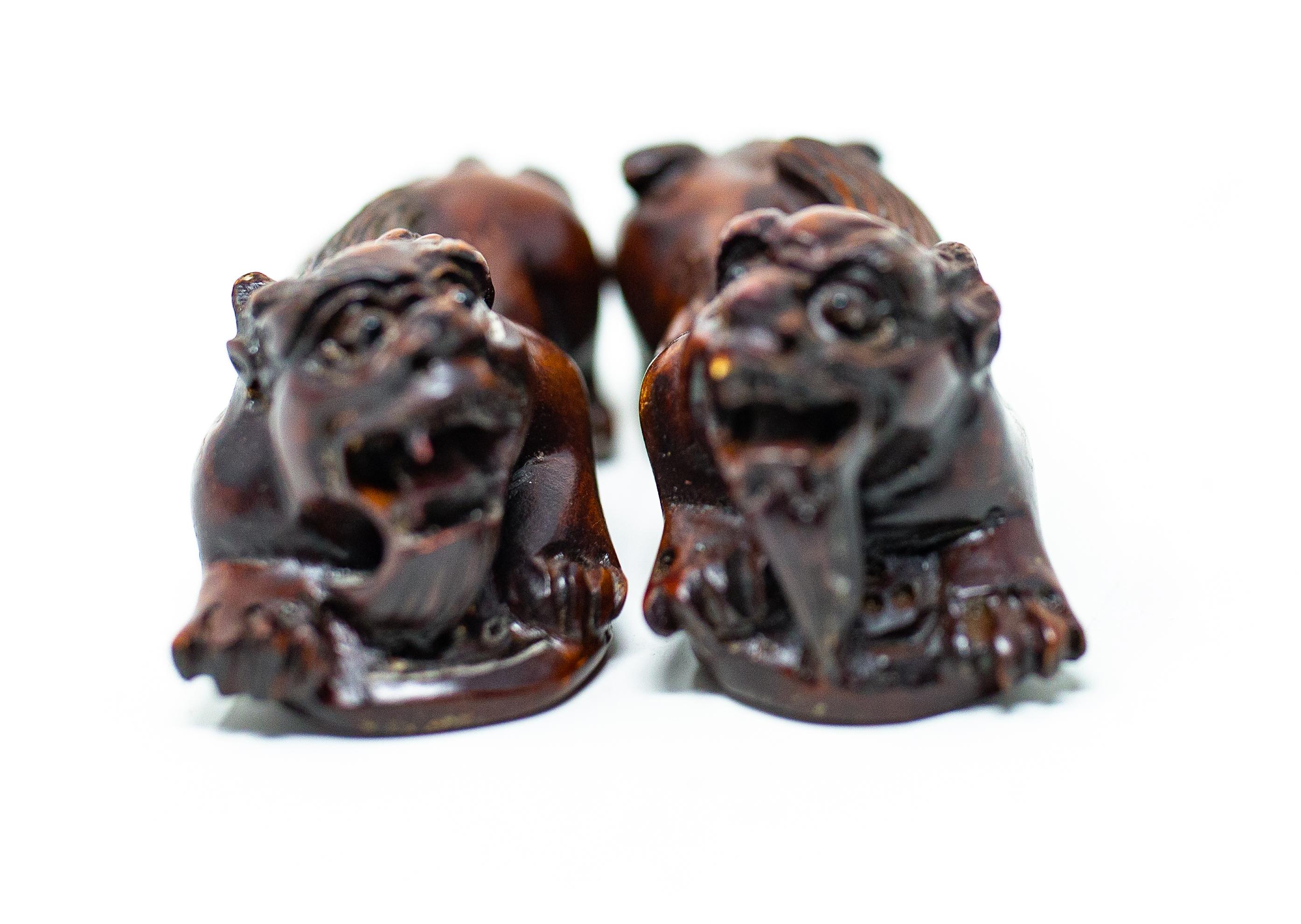 20th Century Hand Carved Wooden Foo Dogs For Sale