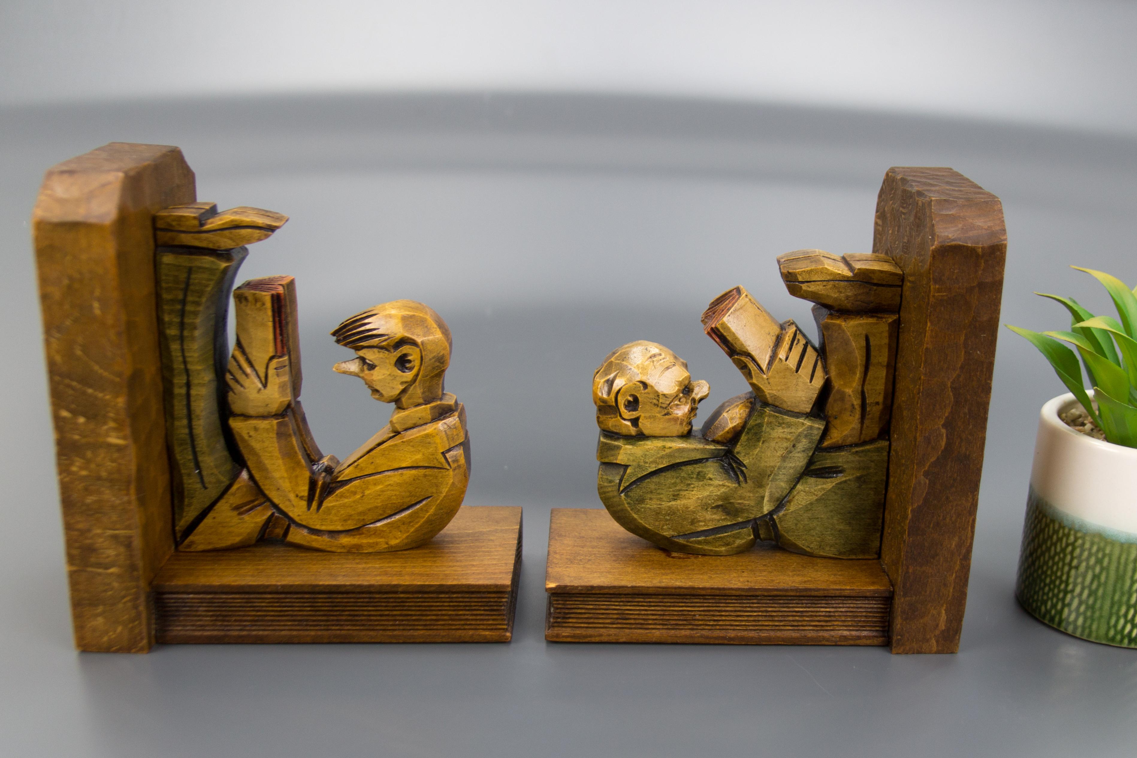 Mid-20th Century Hand Carved Wooden Sculpture Bookends Two Reading Men For Sale