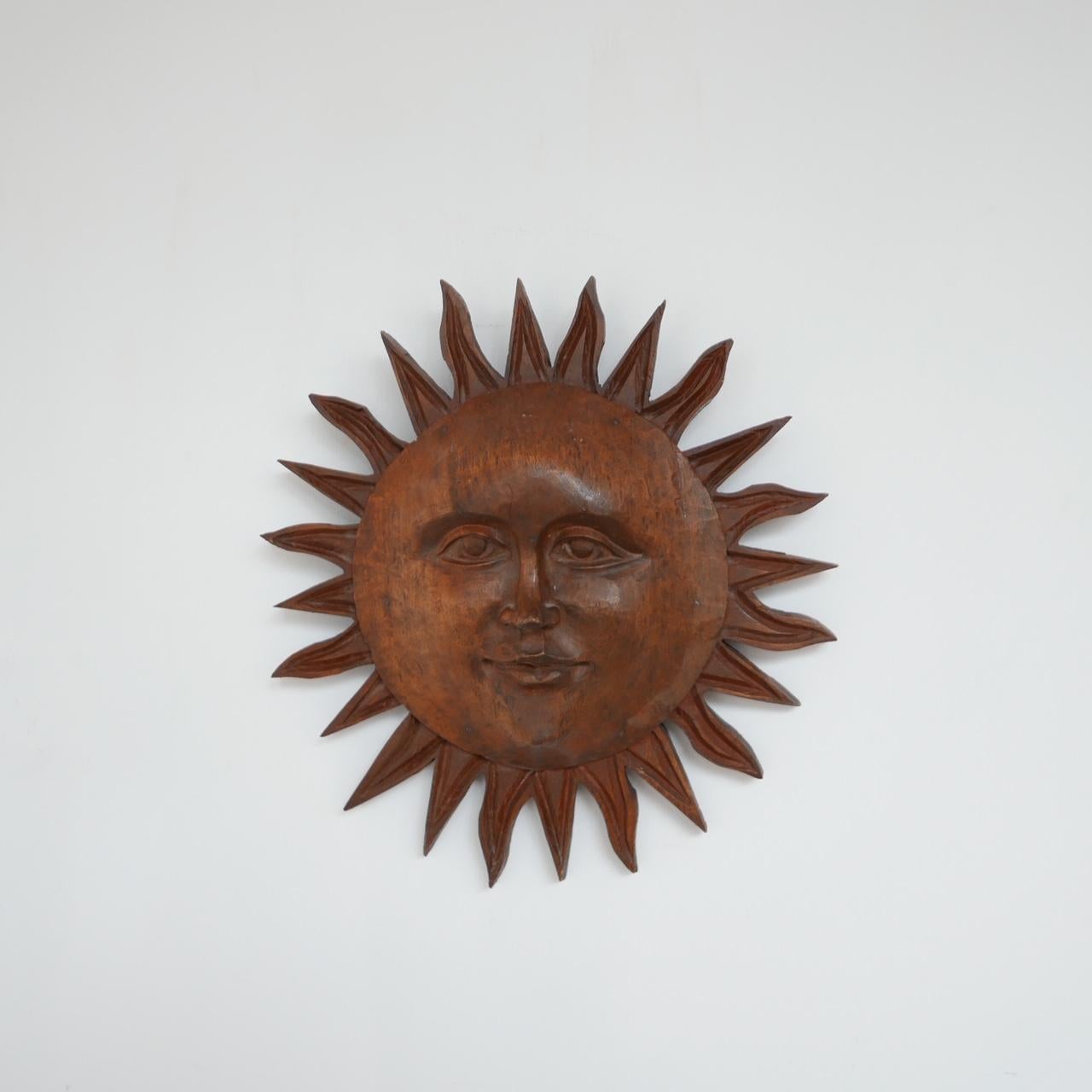 A hand carved wooden sun wall hanging.

France, late 20th century.

Good decorative interior design piece.

Dimensions: 40 diameter x 9 depth in cm.

      