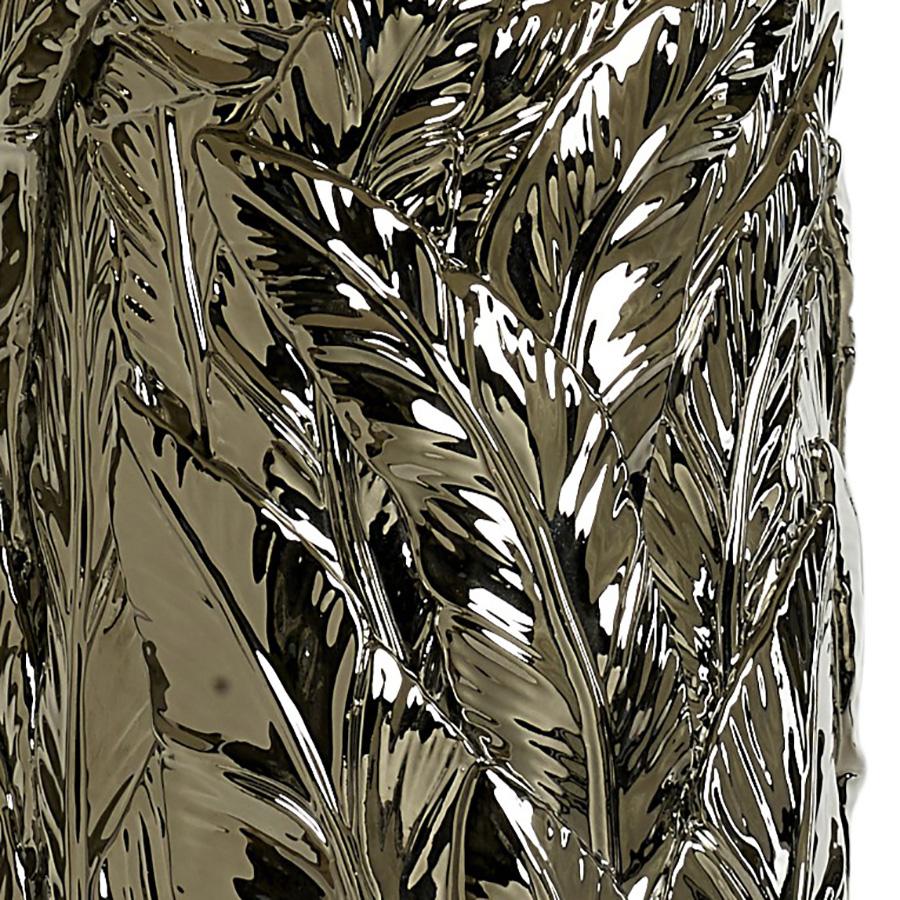 Diseñado y fabricado en exclusiva para Andrew Kornat Designs por uno de los ceramistas más prestigiosos de la histórica Florencia italiana, famosa por la fabricación de porcelana y cerámica durante siglos.

La lámpara de mesa Jungle Leaf se inspira