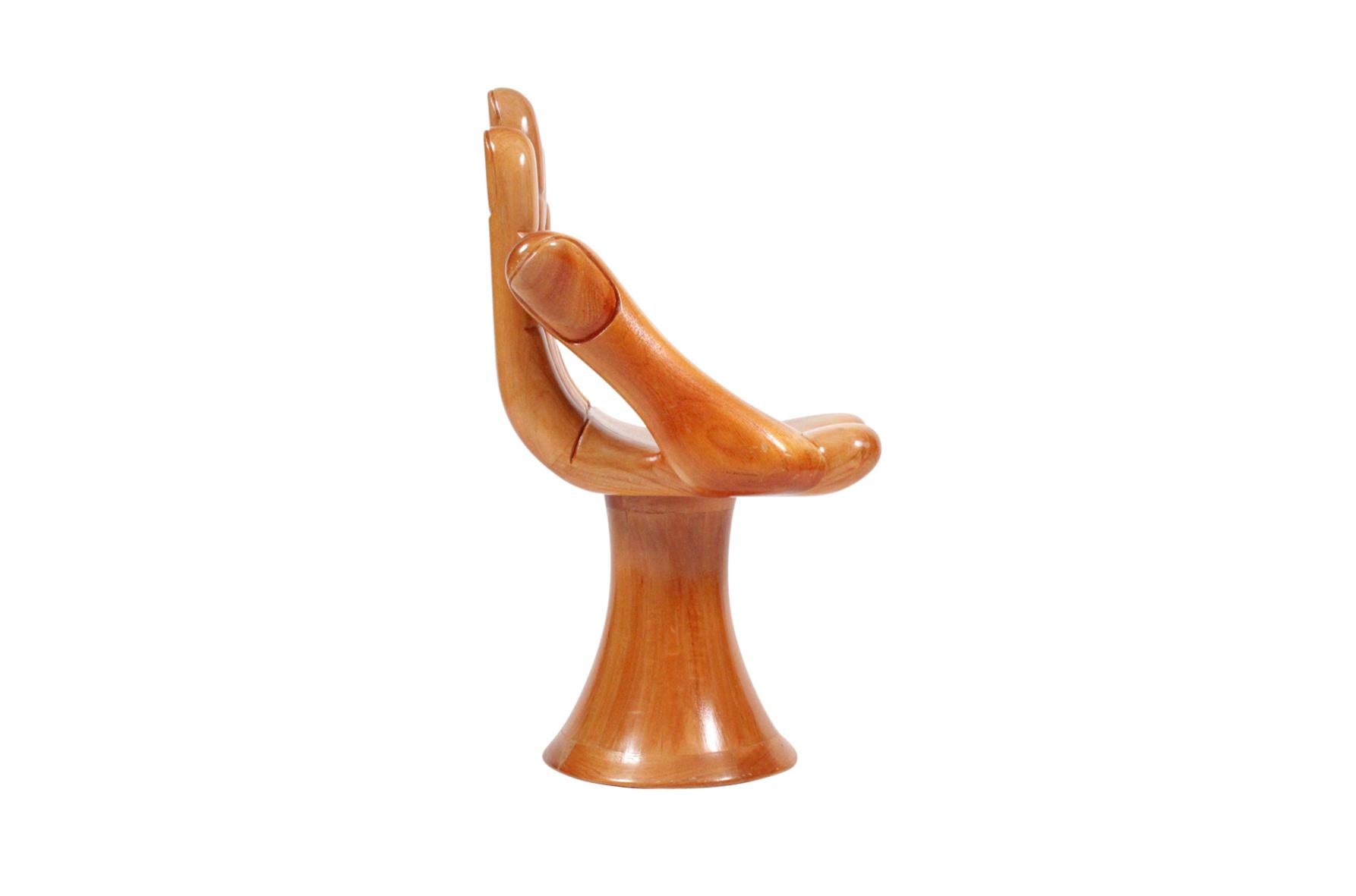 Iconic light walnut hand chair from Mexican designer Pedro Friedeberg. Signed and in very good original condition.
   