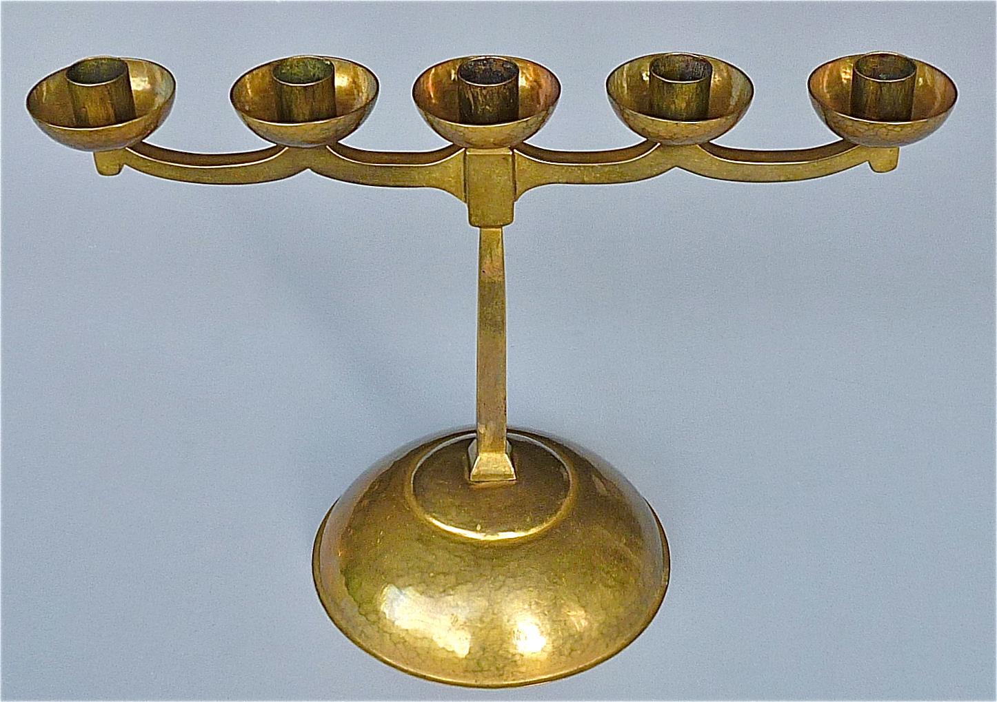 Stunning hand-chased five light solid patinated brass candleholder with hammered surface structure by master August Bohde, Söcking, Germany circa 1920-1930. The heavy candelabra influenced by the Bauhaus and Art Deco movement is marked 5 times with