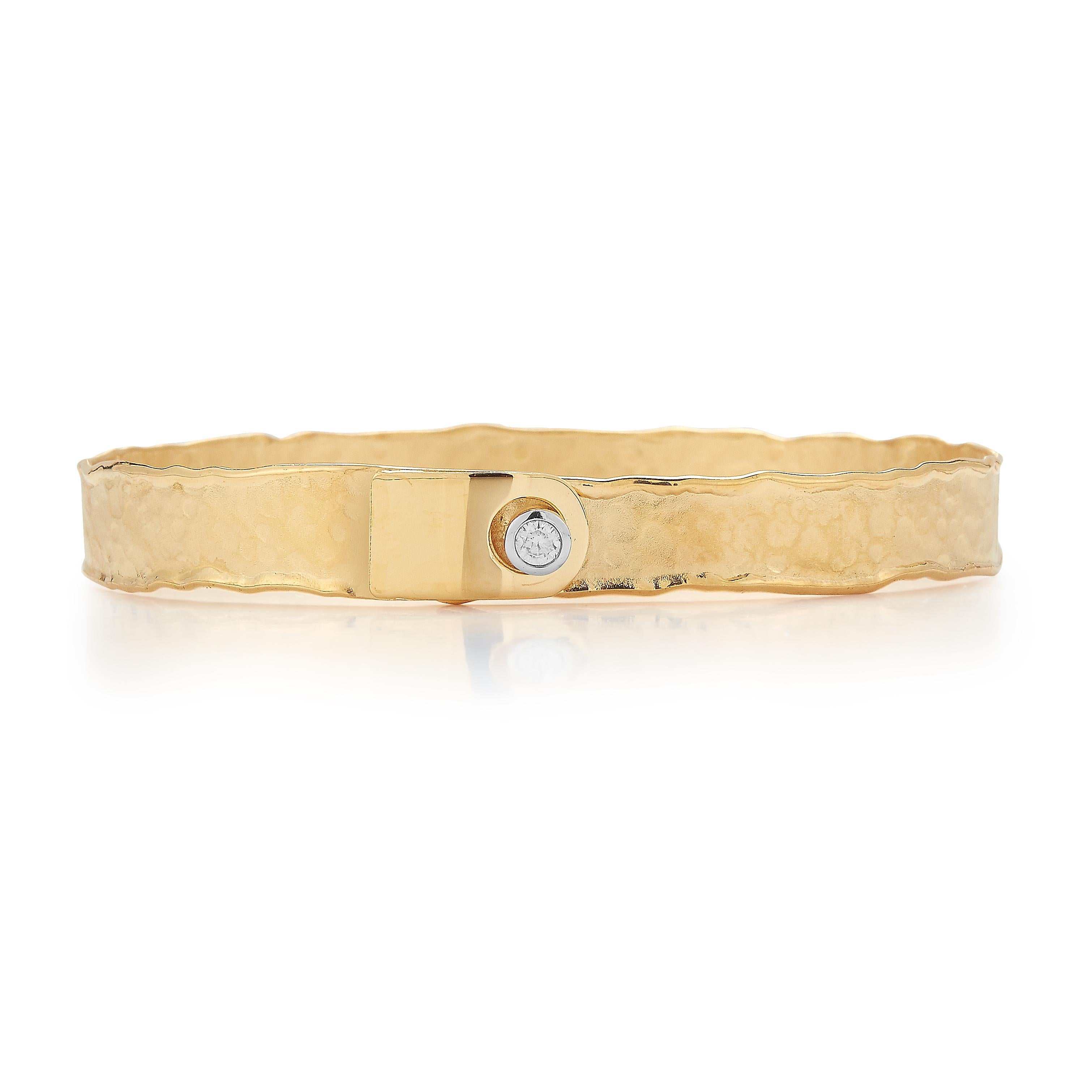 14 Karat Yellow Gold Hand-Crafted Matte and Hammer-Finished Scallop Edged 8mm Cuff Bracelet, Set with a 0.10 Carat Diamond with a Buckle Closure.
