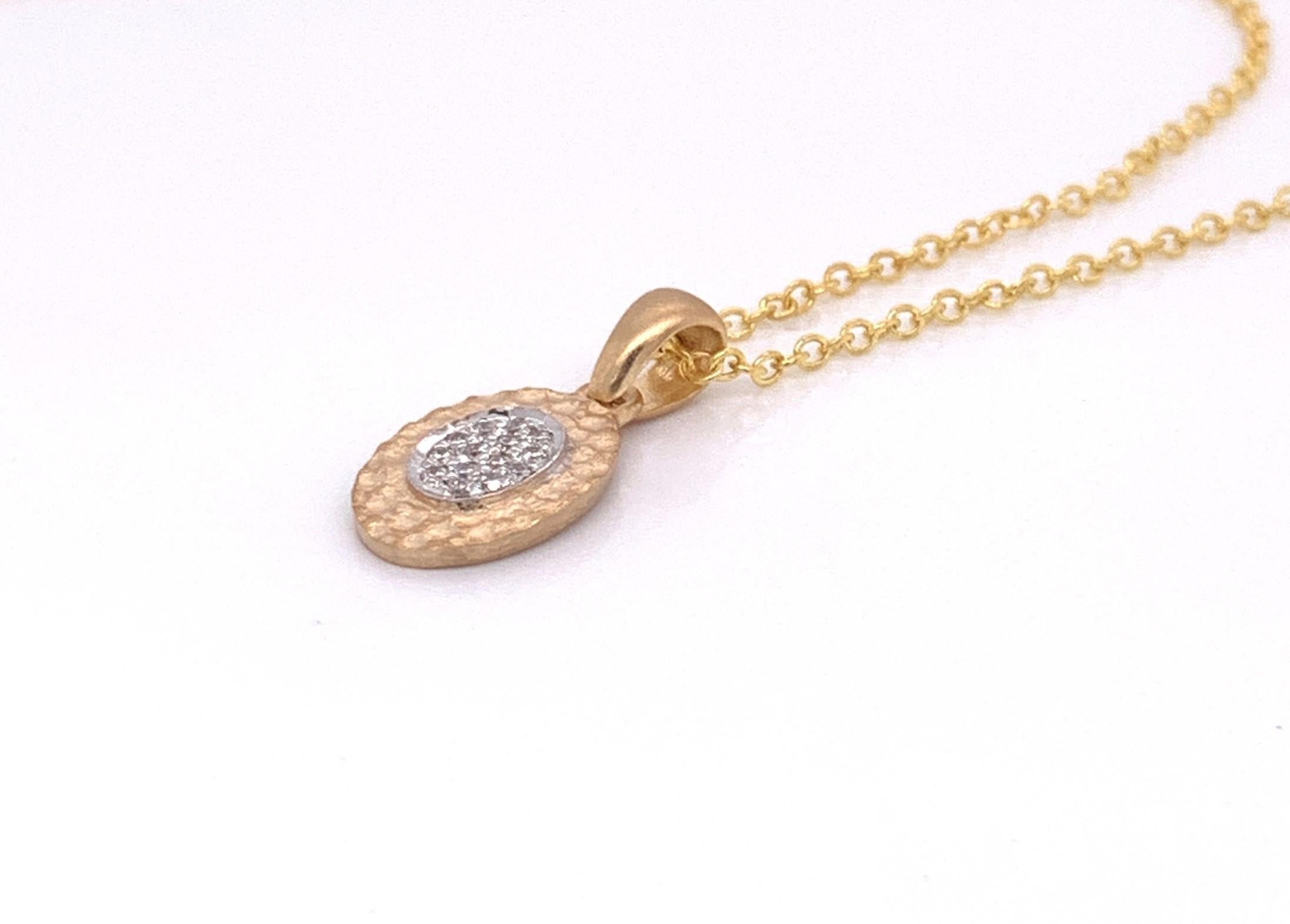 14 Karat Yellow Gold Hand-Crafted Matte and Hammer-Finished 10x8mm Oval Pendant, Centered with 0.07 Carats of Pave Set Diamonds, Sliding on a 16