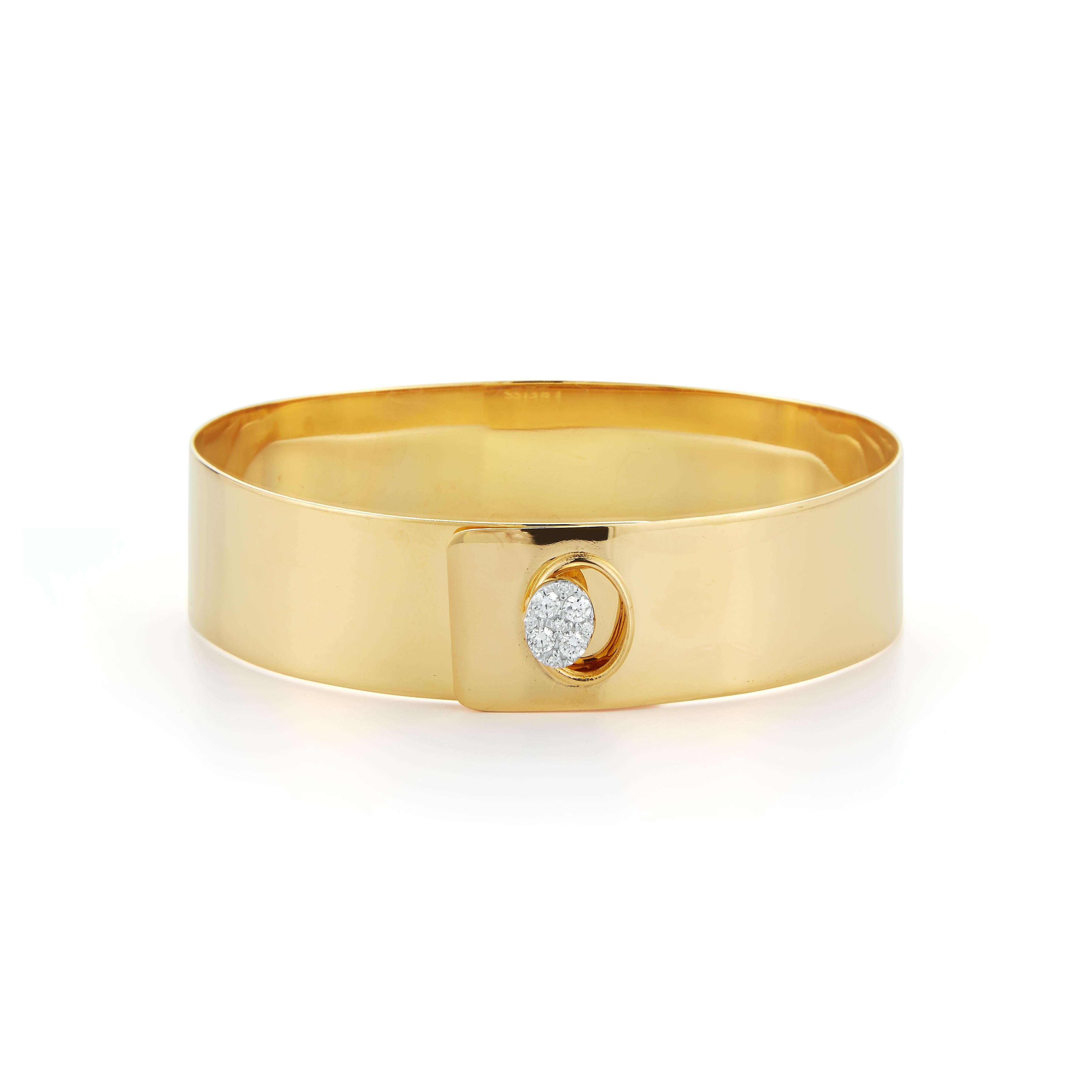 14 Karat Yellow Gold Hand-Crafted Polish-Finished Bangle Bracelet, Accented with 0.23 Carats of a Pave Set Diamond Button Designed with a Buckle Clasp.
