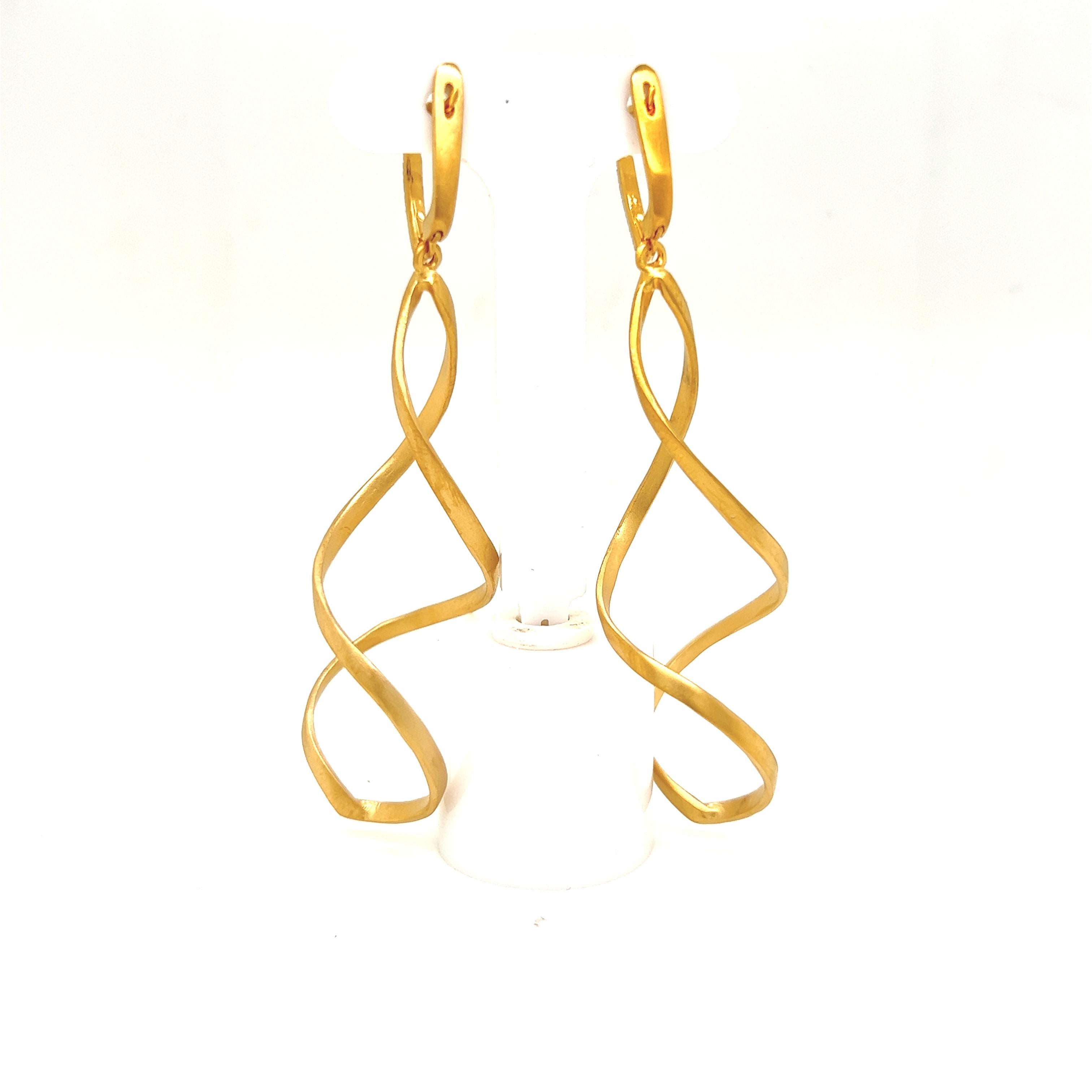 14 Karat Yellow Gold Hand-Crafted Satin-Finished Dangling Spiral Earrings, Accented with 0.09 Carats of Pave Set Diamond Lever Back Closures.
