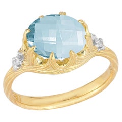 Hecho a mano en oro de 14 quilates 0,05 ct. tw. Anillo de cóctel de diamantes y topacio azul de 4,25 qt