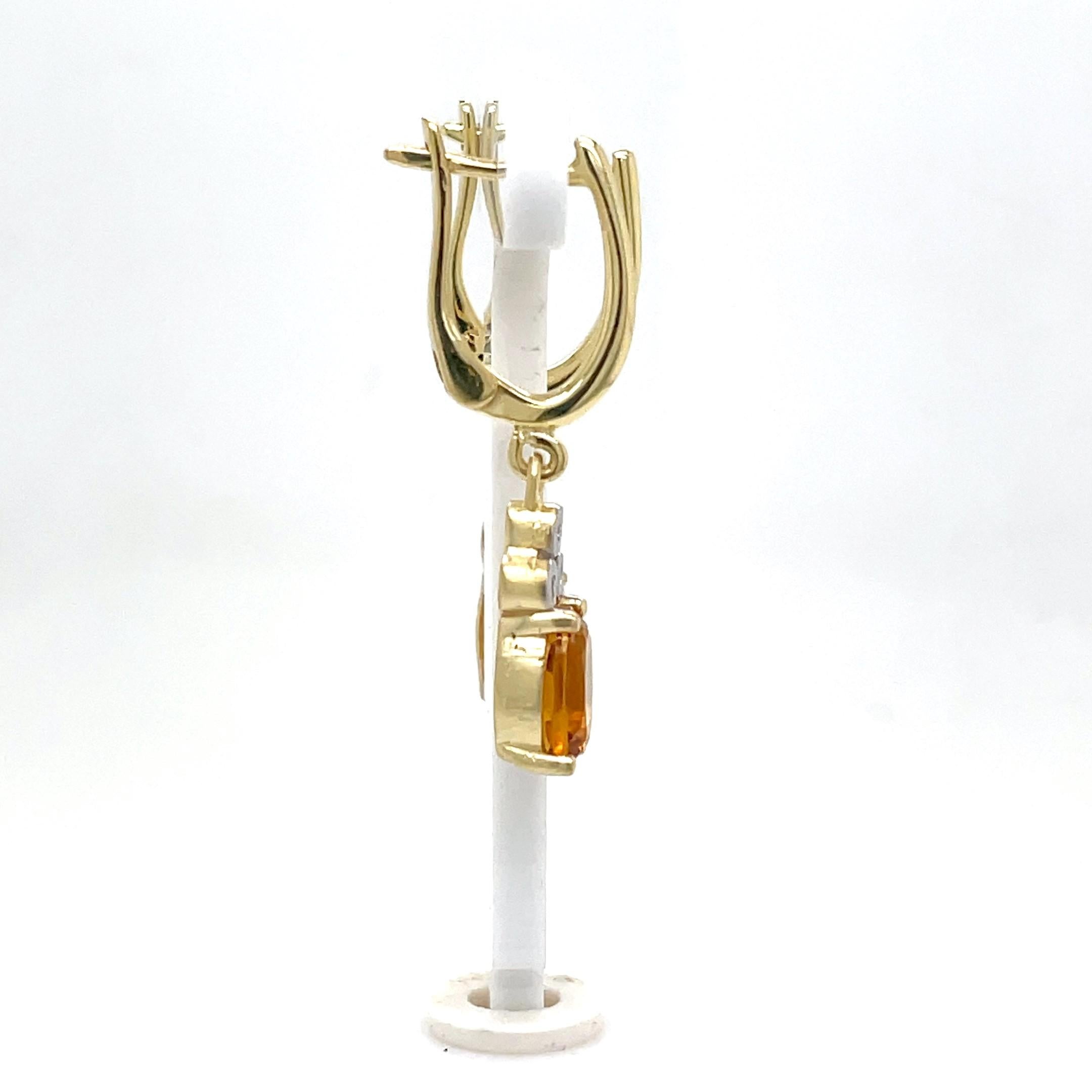 14 Karat Yellow Gold Hand-Crafted Polish-Finished Dangling Earrings, Set with 6x8mm 2.34CT Oval-Shaped Checkerboard-Cut Citrine Semi-Precious Color Stones, and Accented with 0.09 Carat Bezel Diamonds
