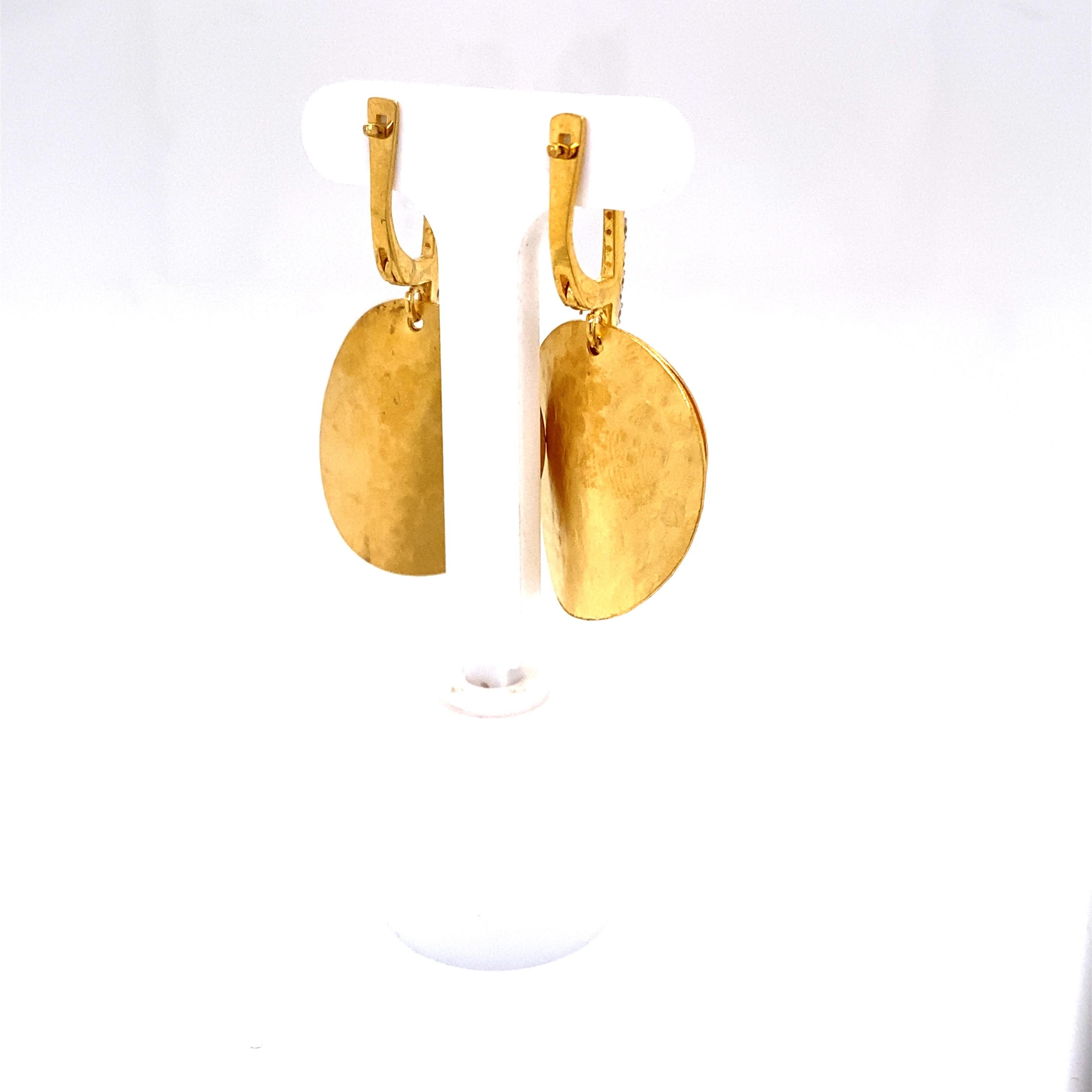 14 Karat Yellow Gold Hand-Crafted Matte and Hammer-Finished Dangling Two-Disk Earrings, Accented with 0.15 Carats of Pave Set Diamond Lever Back Closures.
