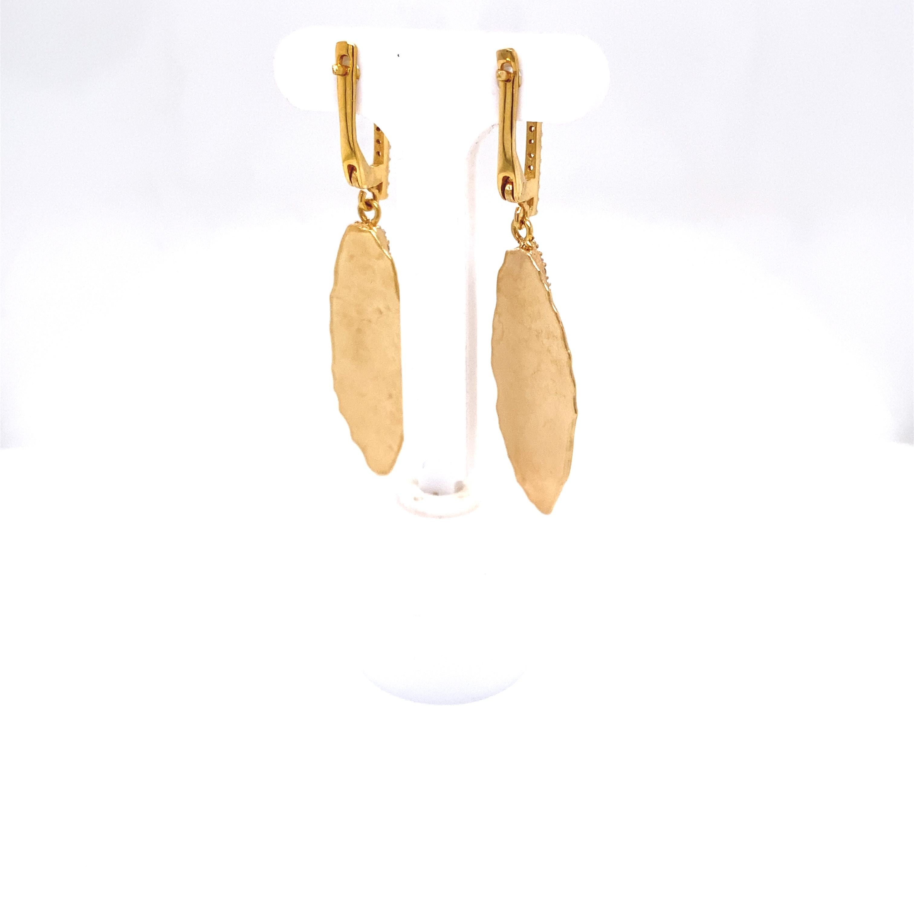 14 Karat Yellow Gold Hand-Crafted Matte and Hammer-Finished Dangling Leaf Earrings, Accented with 0.35 Carat Diamonds, Set on a Leverback Finding.

