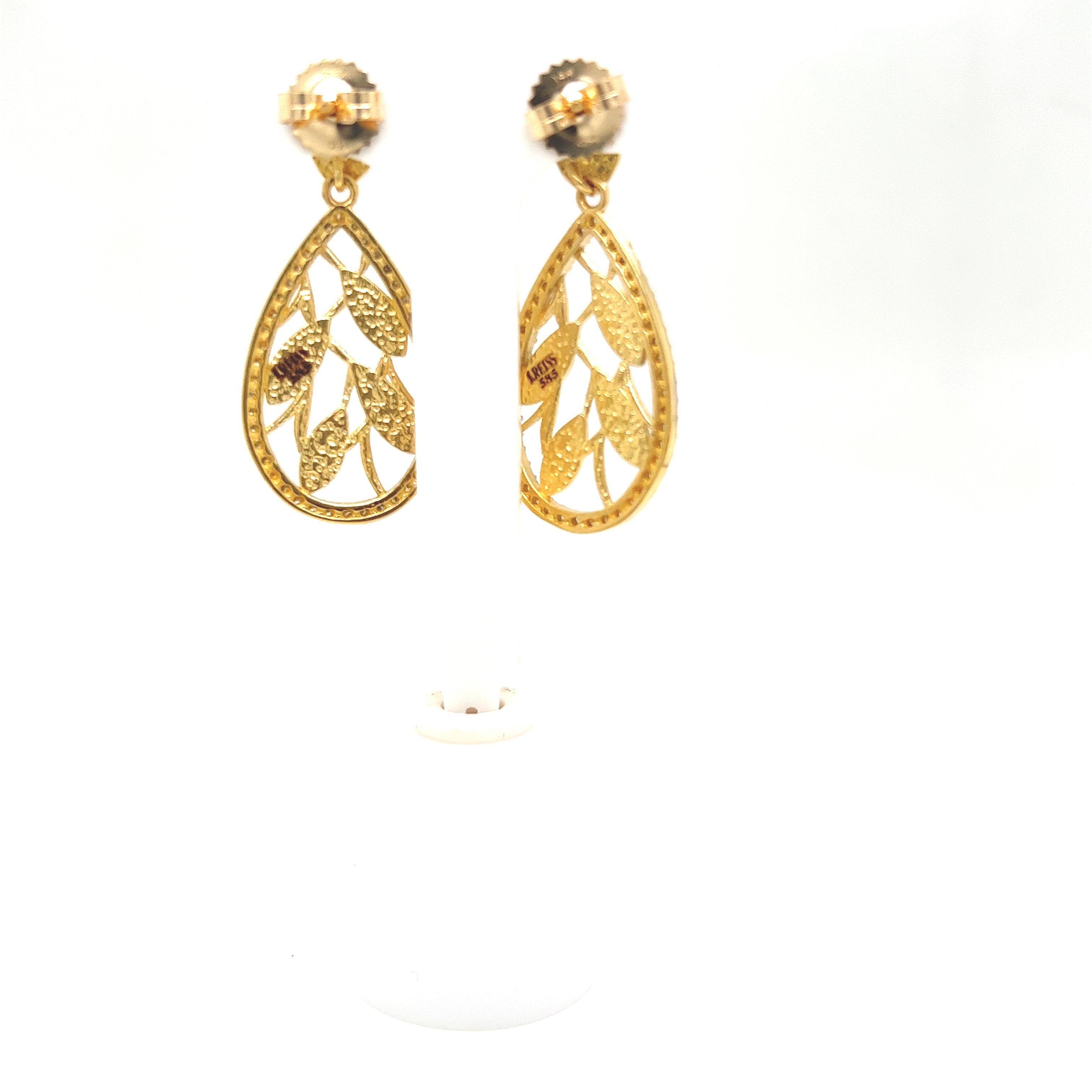 14 Karat Yellow Gold Polish-Finished Dangling Tear-Drop Vine Leaf Earrings, Accented with 0.58 Carats of Pave Set Diamonds.  Post with Friction Closure.
