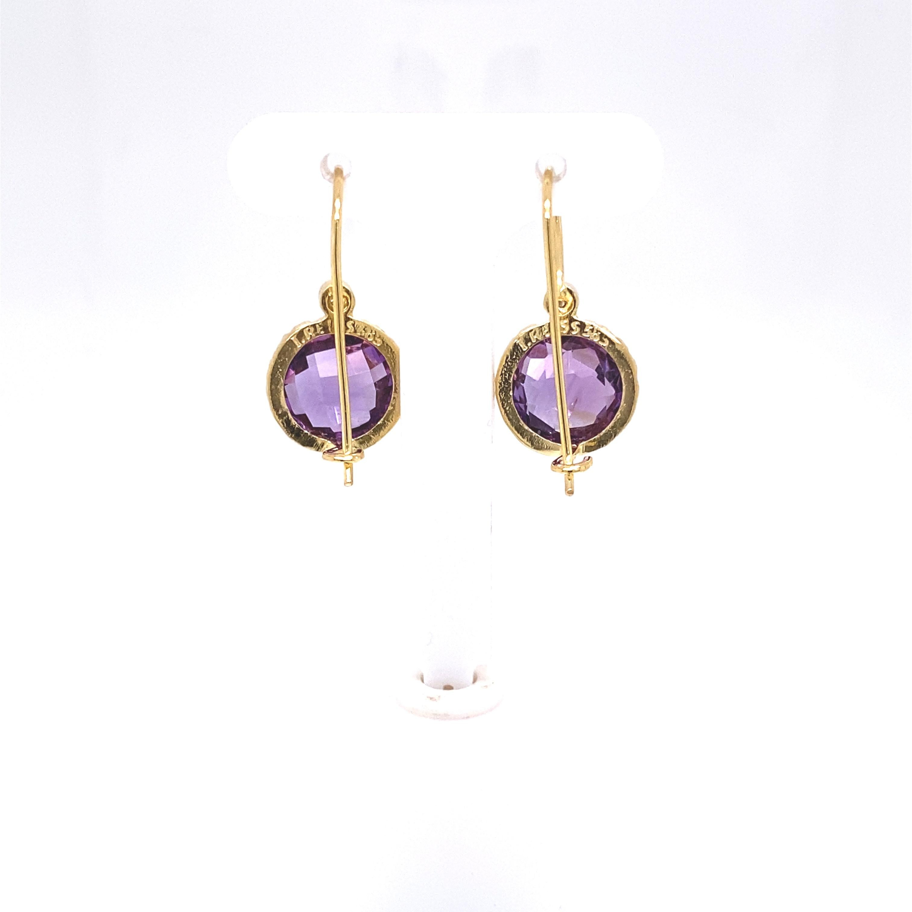 14 Karat Yellow Gold Hand-Crafted Polish-Finished Drop Earrings, Centered with a 10mm Round Checkerboard-Cut Semi-Precious Amethyst Color Stone, Accented with 0.03 Carats of Bezel Set Diamonds.

