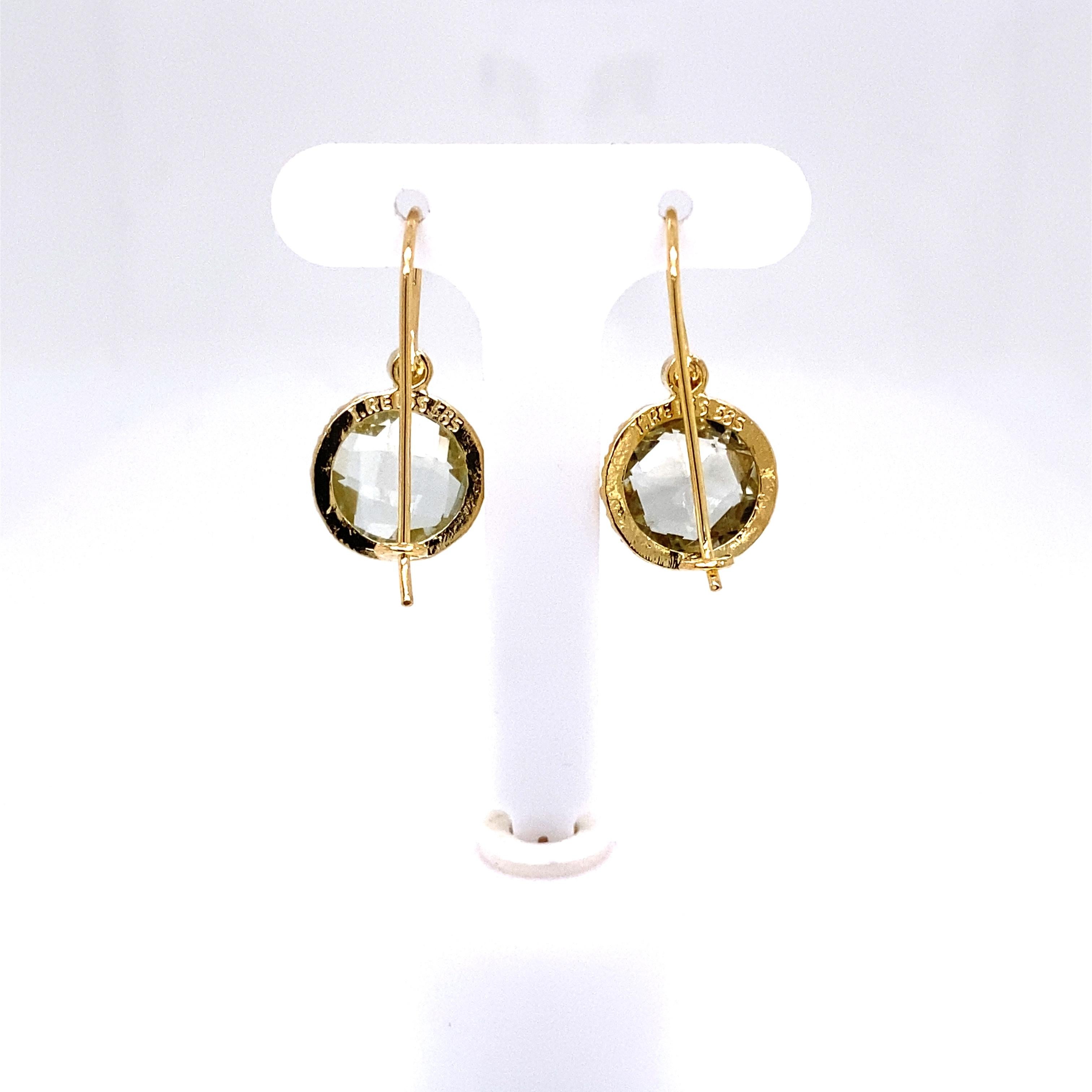 14 Karat Yellow Gold Hand-Crafted Polish-Finished Drop Earrings, Centered with a 10mm Round Checkerboard-Cut Semi-Precious Green Amethyst Color Stone, Accented with 0.03 Carats of Bezel Set Diamonds.
