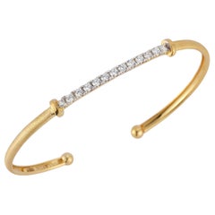 Bracciale flessibile in oro giallo 14K realizzato a mano.