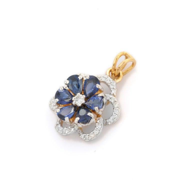 Crafted in luxurious 18k yellow gold, this exquisite floral pendant showcases a captivating design inspired by the elegance of blooming flowers. At its heart, 2.45 carats of rich blue sapphires are arranged like delicate petals, radiating a deep,