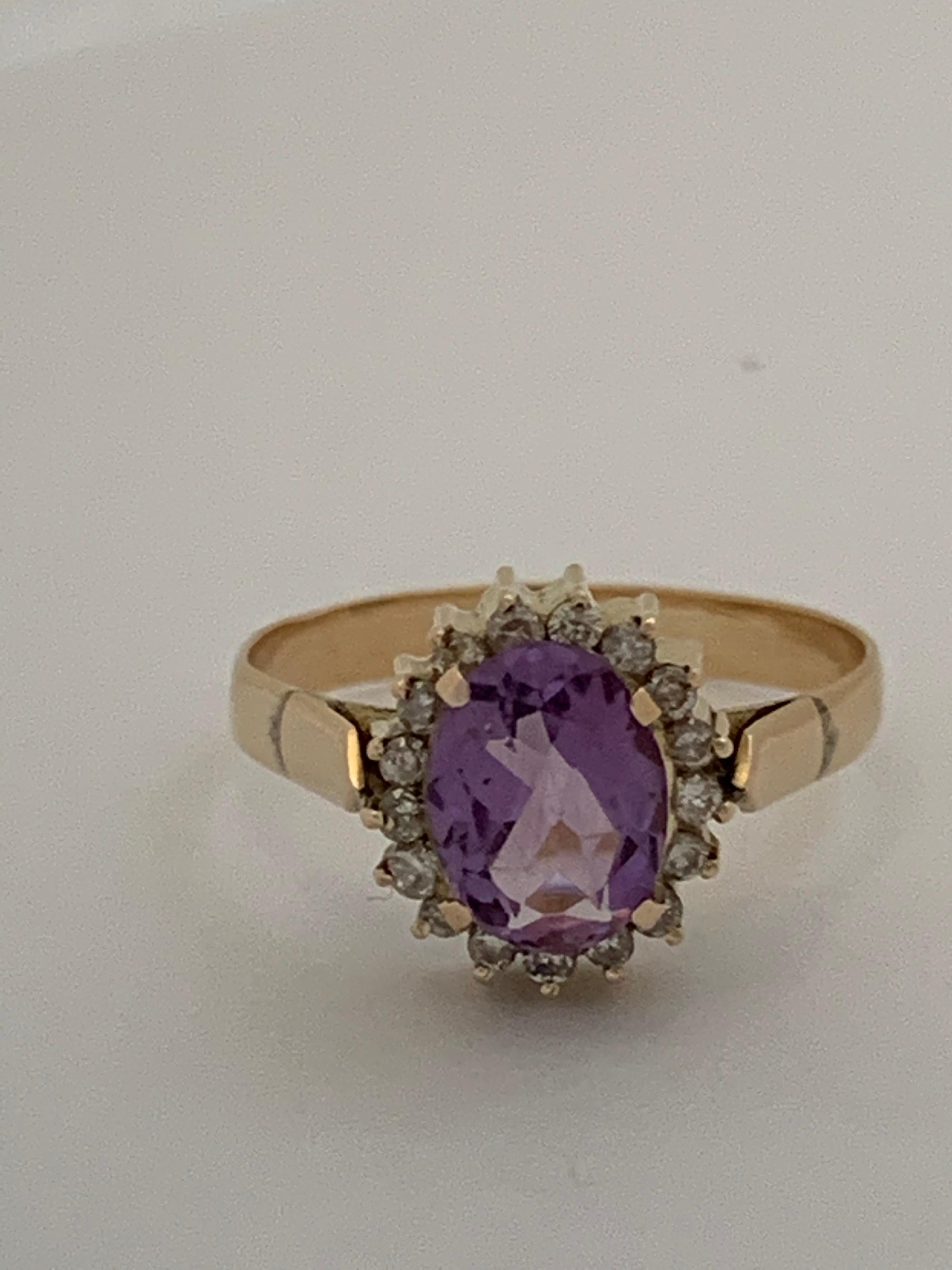 Oval Cut Handcrafted Amethyst and Diamond Set in 14 Karat Yellow Gold Ring For Sale