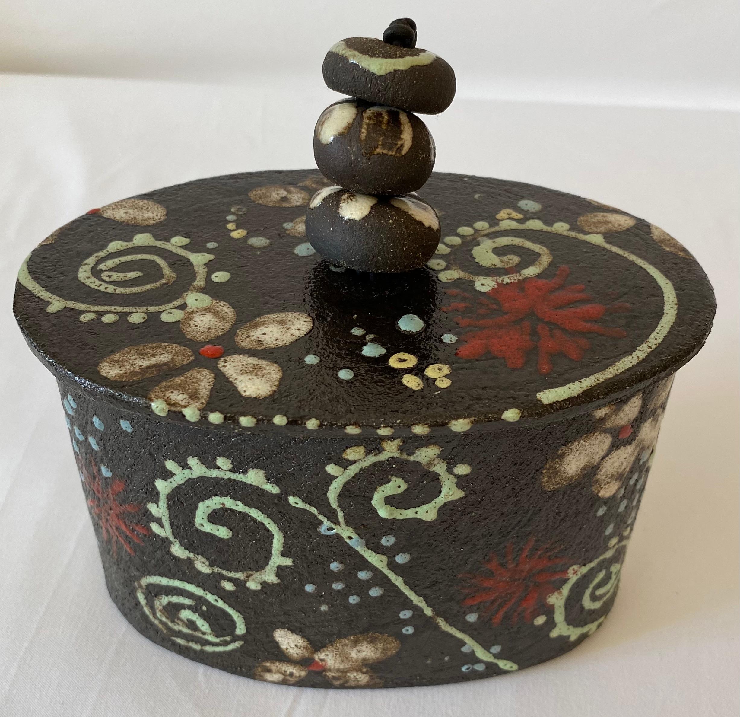 A beautiful hand-crafted ceramic lidded trinket or jewelry box. 
Mid-20th century, French. 
Used as decorative item, this piece would enhance any shelf or tabletop.

Measures:  6 1/8