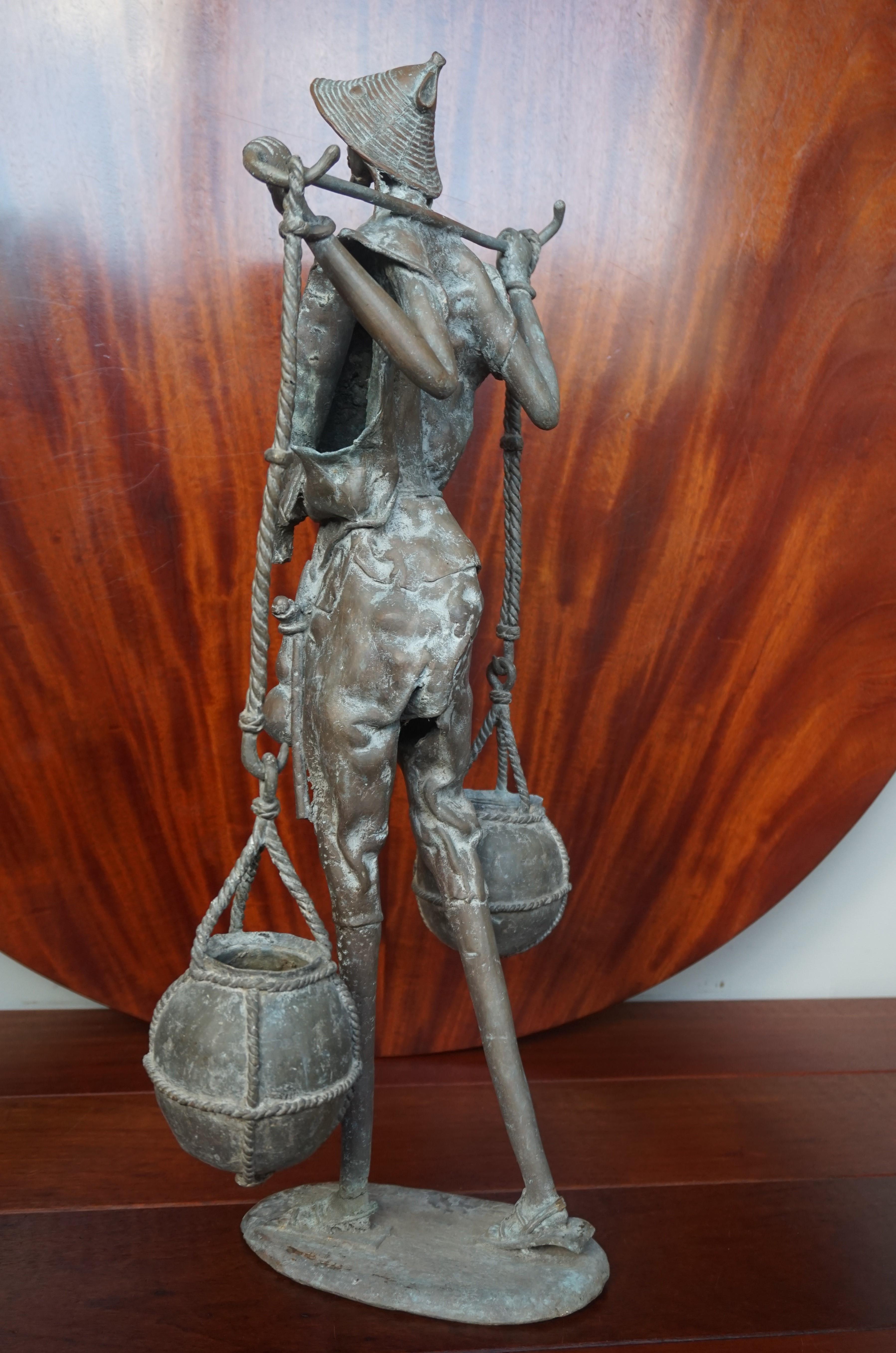 Handcrafted and Wonderful Tall African Male Water Carrier Bronze Sculpture For Sale 5