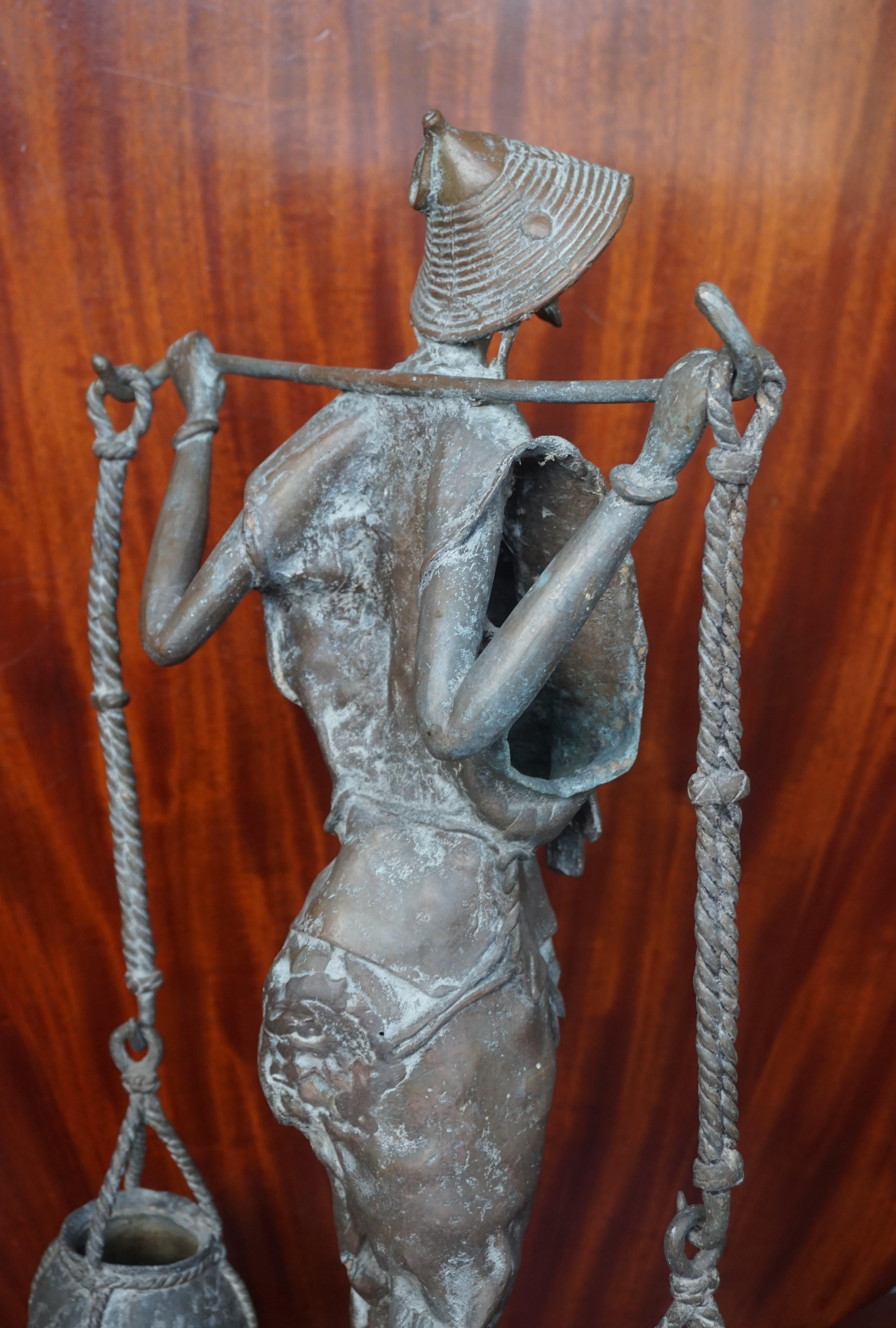Handcrafted and Wonderful Tall African Male Water Carrier Bronze Sculpture For Sale 6