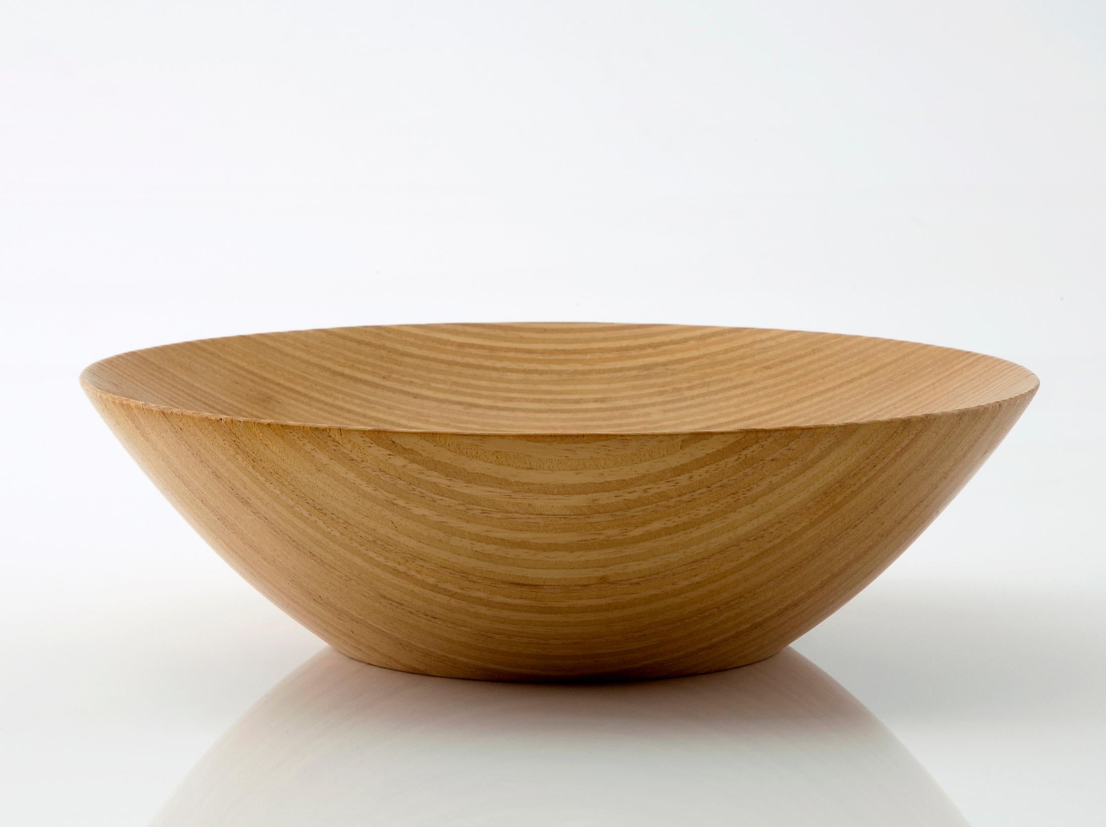 Inlaid bowl handcrafted in stack-laminated Brazilian hardwood. Designed and made by Julia Krantz, Sao Paulo, Brazil, 2007.
 