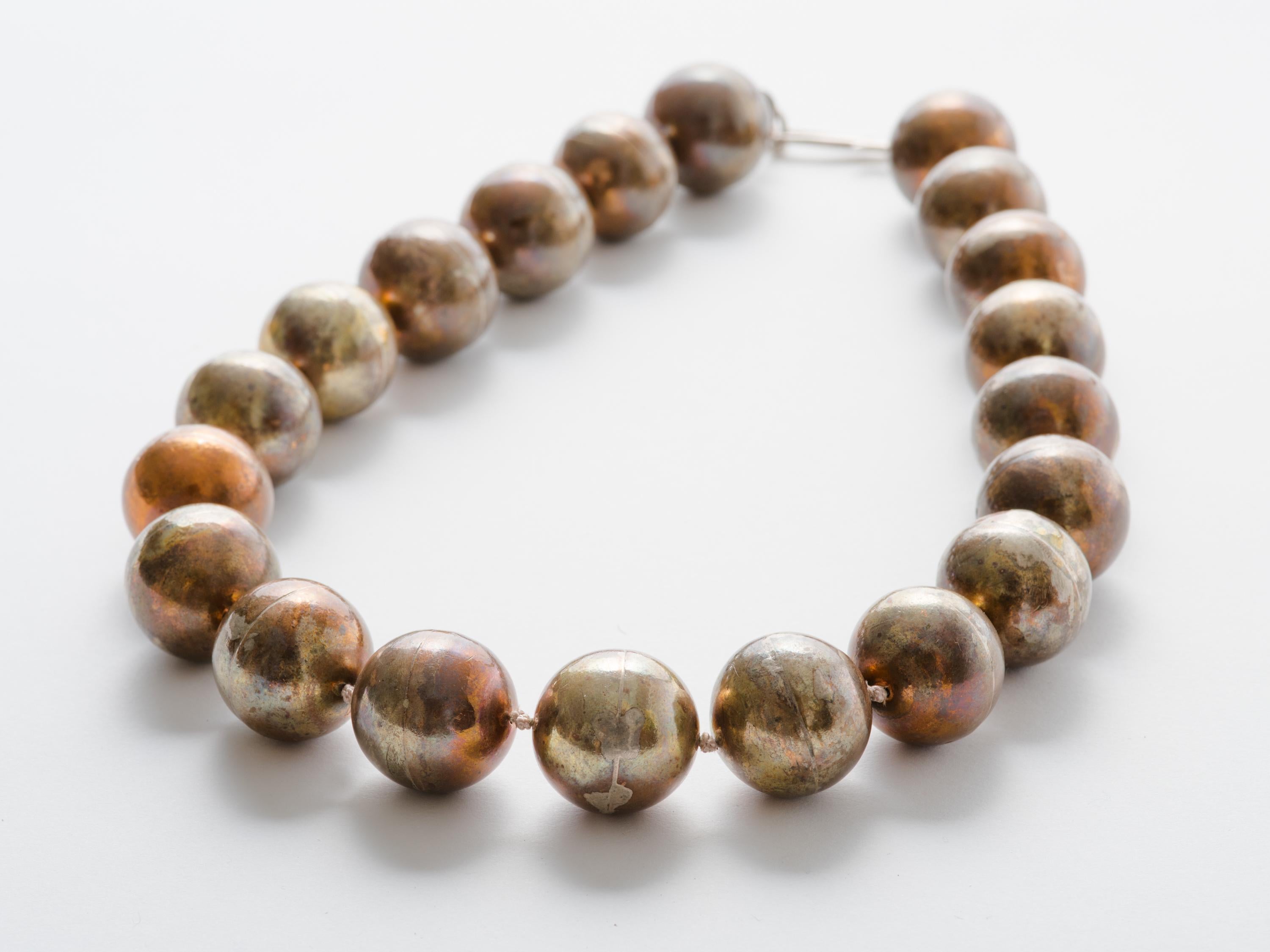 Hand crafted large bronze bead necklace with sterling silver catch by jewelry artist Mark Timmerman. Necklace has 20 handmade bronze beads measuring 7/8
