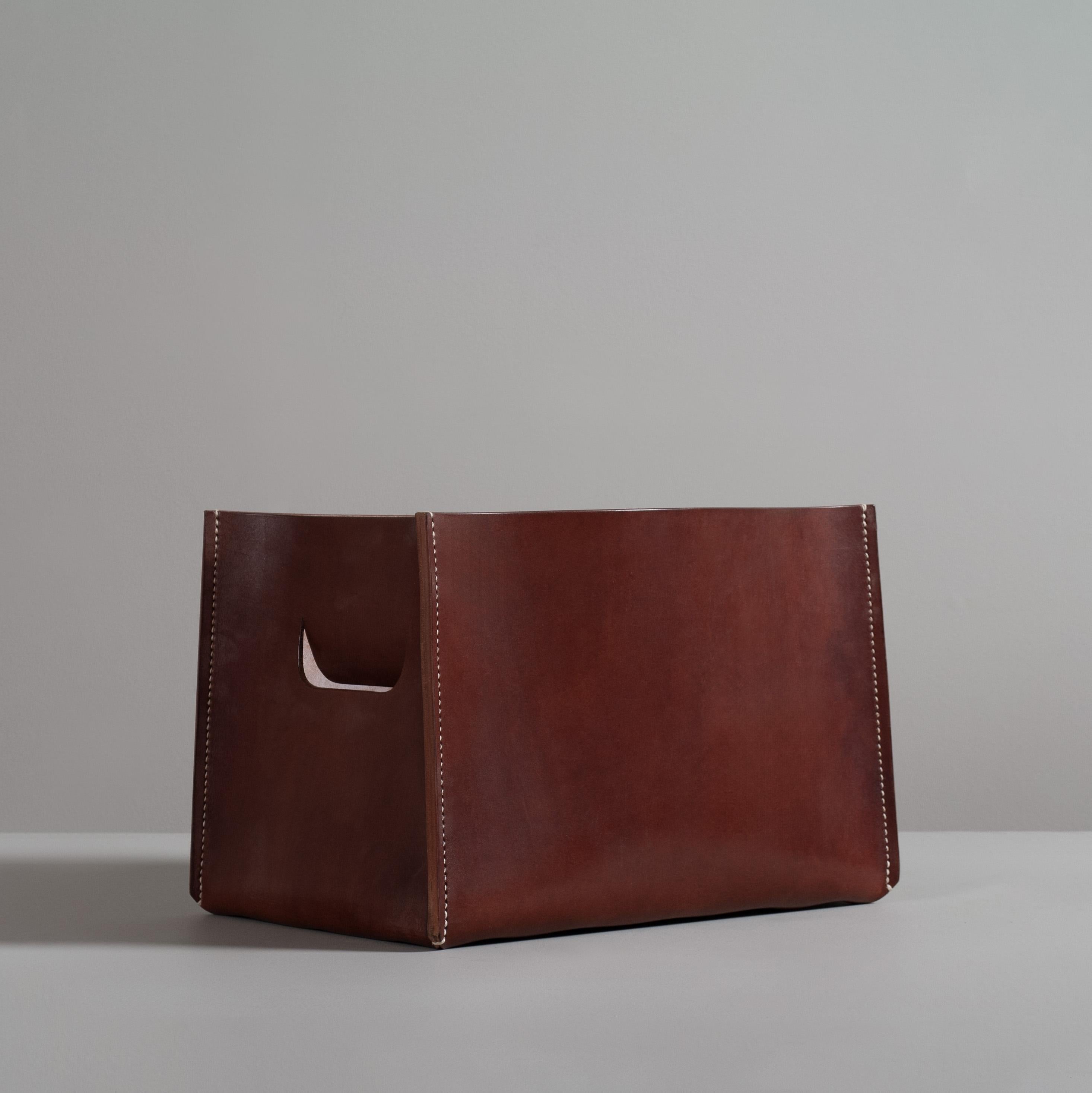 Hand cut, hand-stitched and riveted from the very finest English heavy bridle leather. Solid English oak with burr copper rivet base. The box is hand saddle stitched in the traditional way with waxed linen cord forming a solid upright structure with
