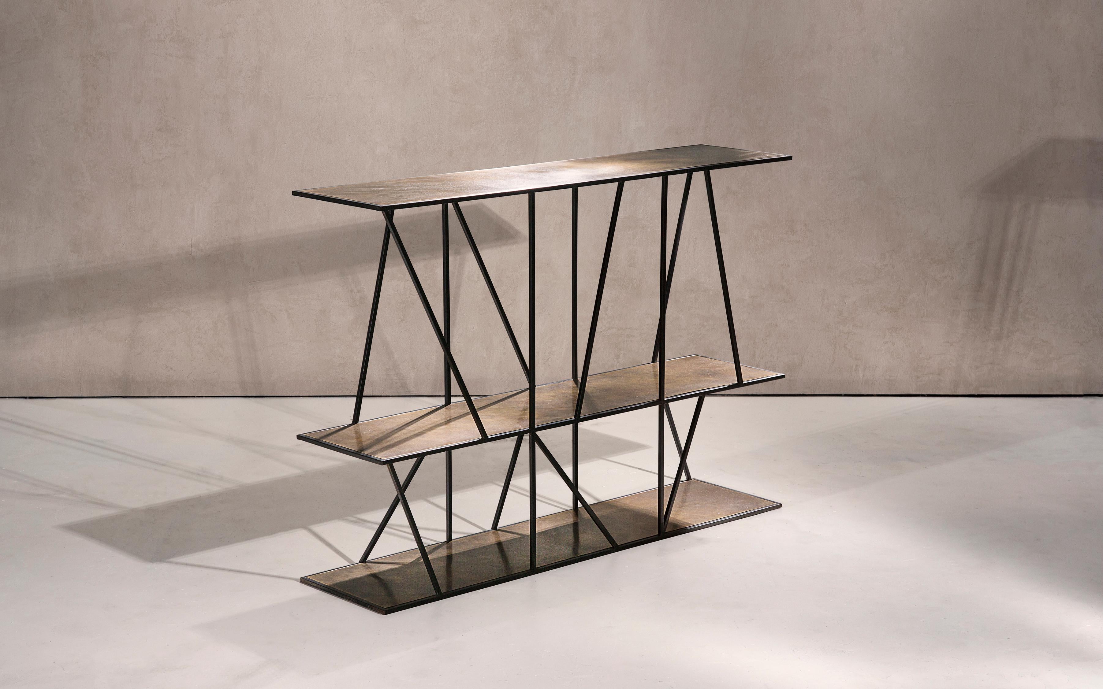 Medium Staiths Handcrafted console signed by Novocastrian
Materials: Patinated Brass
Dimensions: 150L x 30W x 80H
Custom sizes and finishes are available.

A sculptural console table in black patinated steel and patinated brass. Handcrafted in the