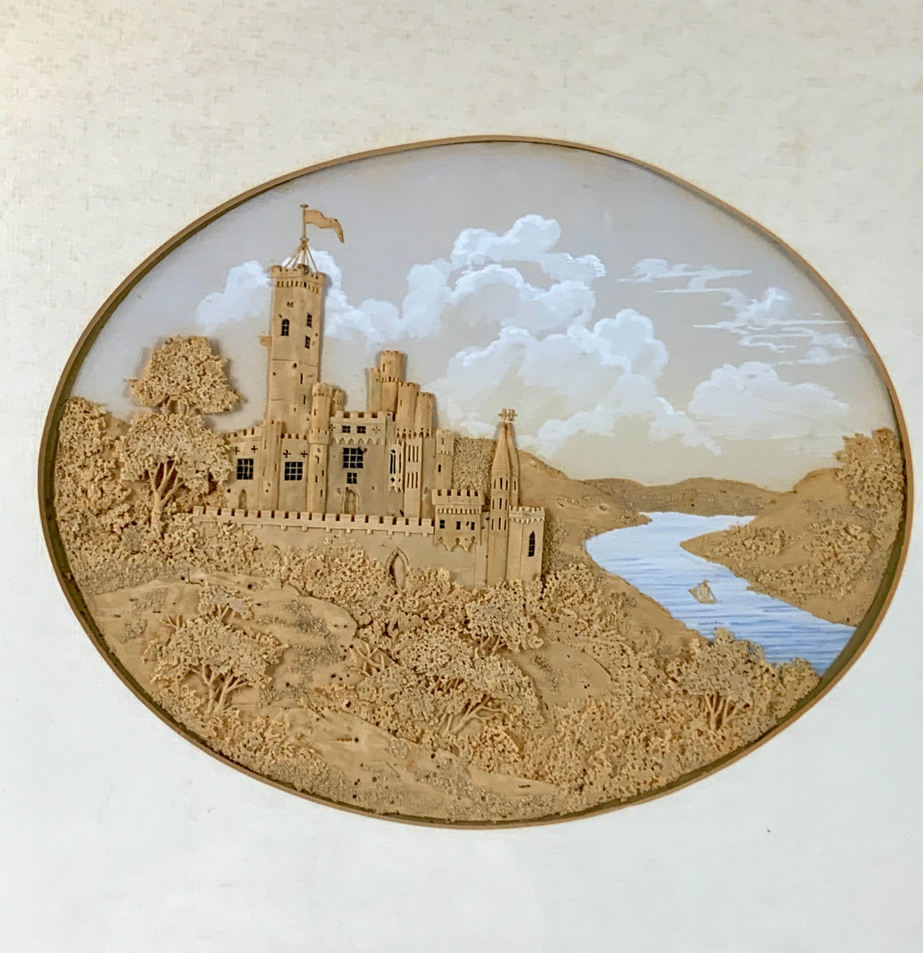  This mid 19th century cork work shows a romantic scene of an ancient castle in a charming diorama. The castle is perched atop a promontory overlooking a river, complete with forested terrain and a tiny sailboat for scale. The artist's intricate