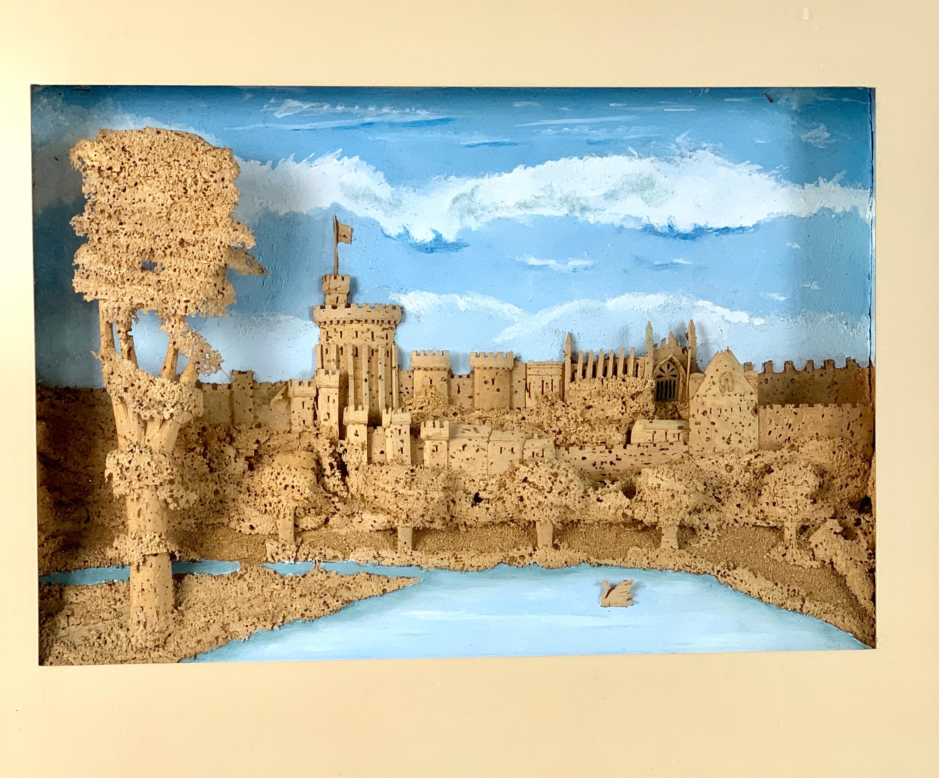  This hand crafted cork work shows a romantic scene of an ancient castle in a charming diorama. The castle is perched atop a promontory overlooking a river, complete with forested terrain and a tiny swan. The artist's intricate cutting and piercing