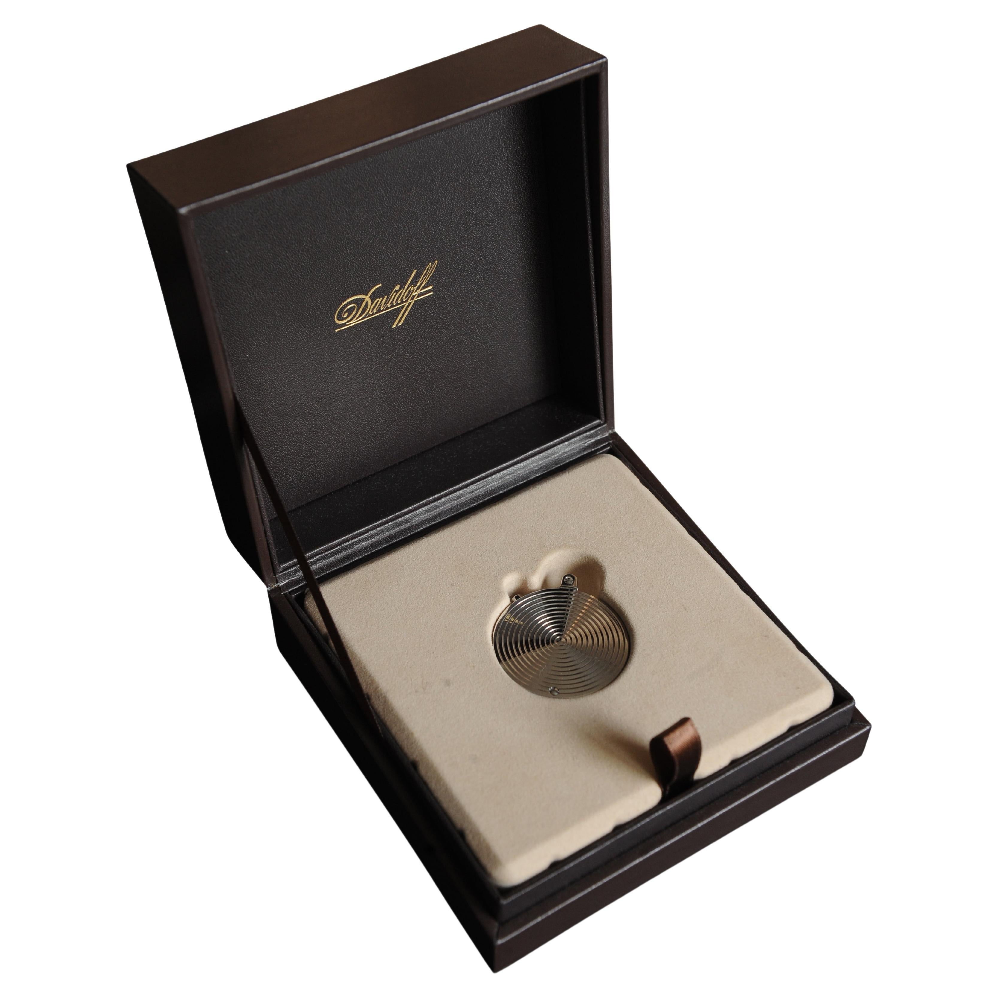 Davidoff Steel Circular Cigar Punch Cutter with Original Paper & Box Made in Germany 

Carry a trio of cigar punches in your pocket, in no more space than is taken up by a pocketwatch. This round stainless steel case from Davidoff features three