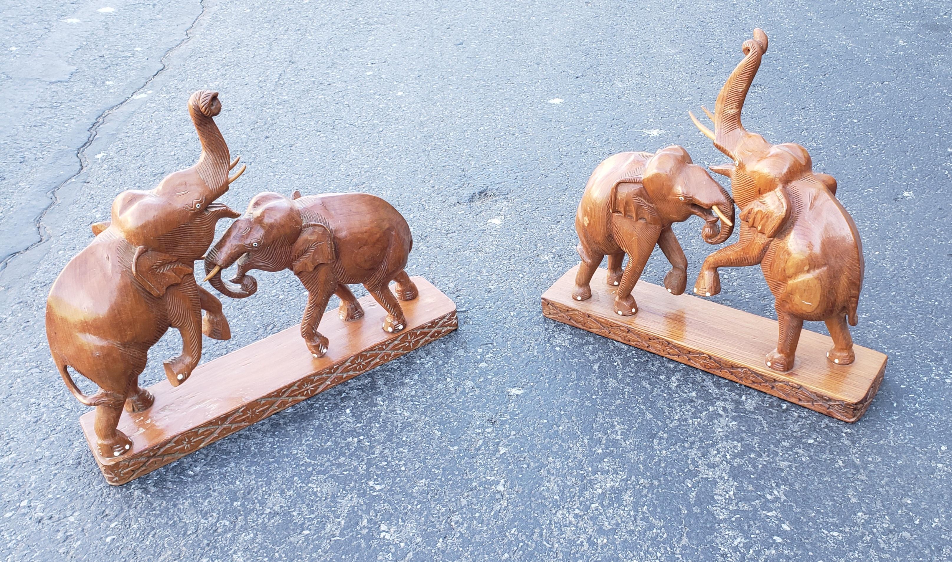 handcrafted fruitwood elephant figurals in good vintage condition.
Measures 18 inches in width, 4.25