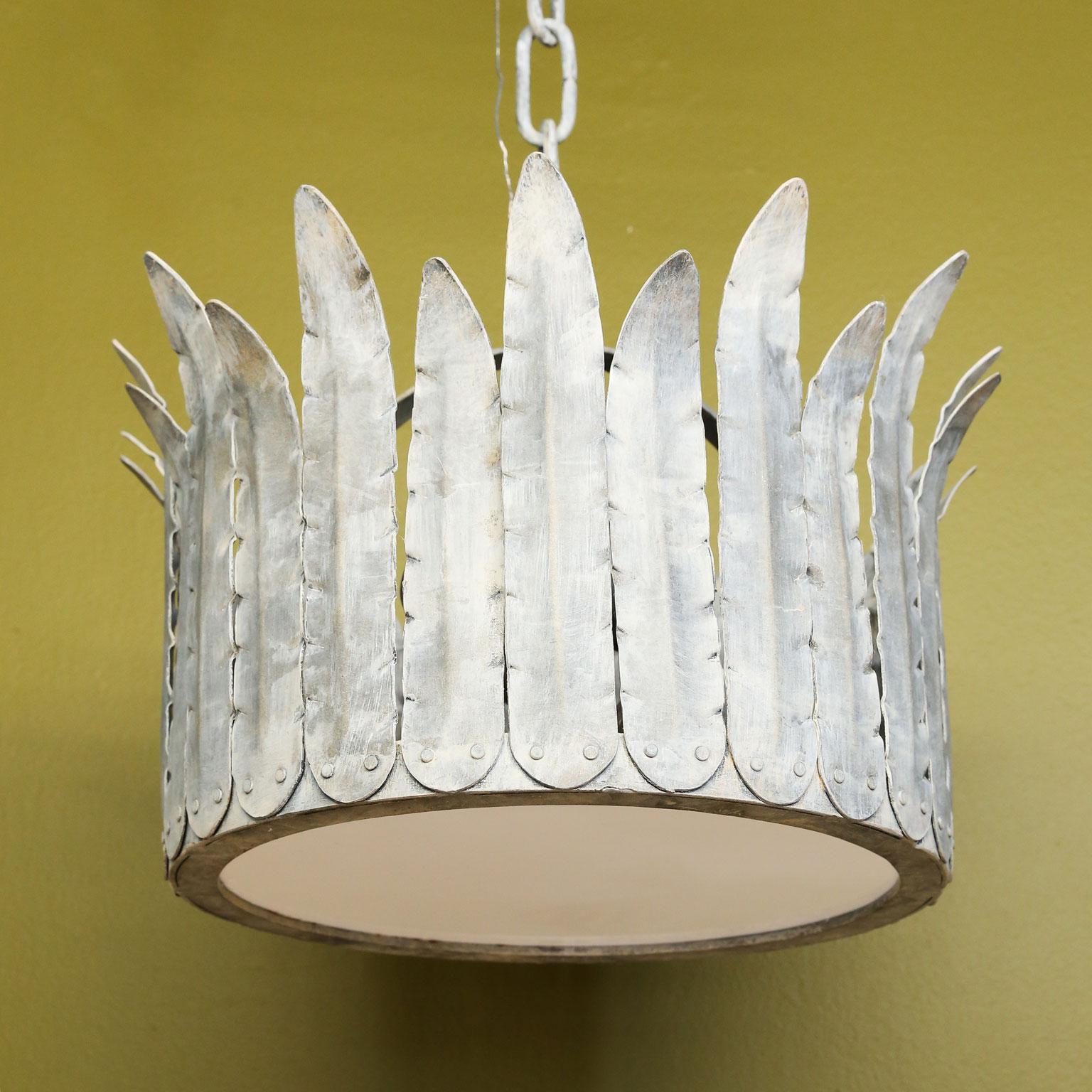 Handcrafted iron “Fairfield” crown light is a metal light fixture with crimped-edged tole feathers in a silver finish. Three porcelain Edison sockets inside with glass bottom. Newly wired for use within the USA using all UL listed parts. Multiples