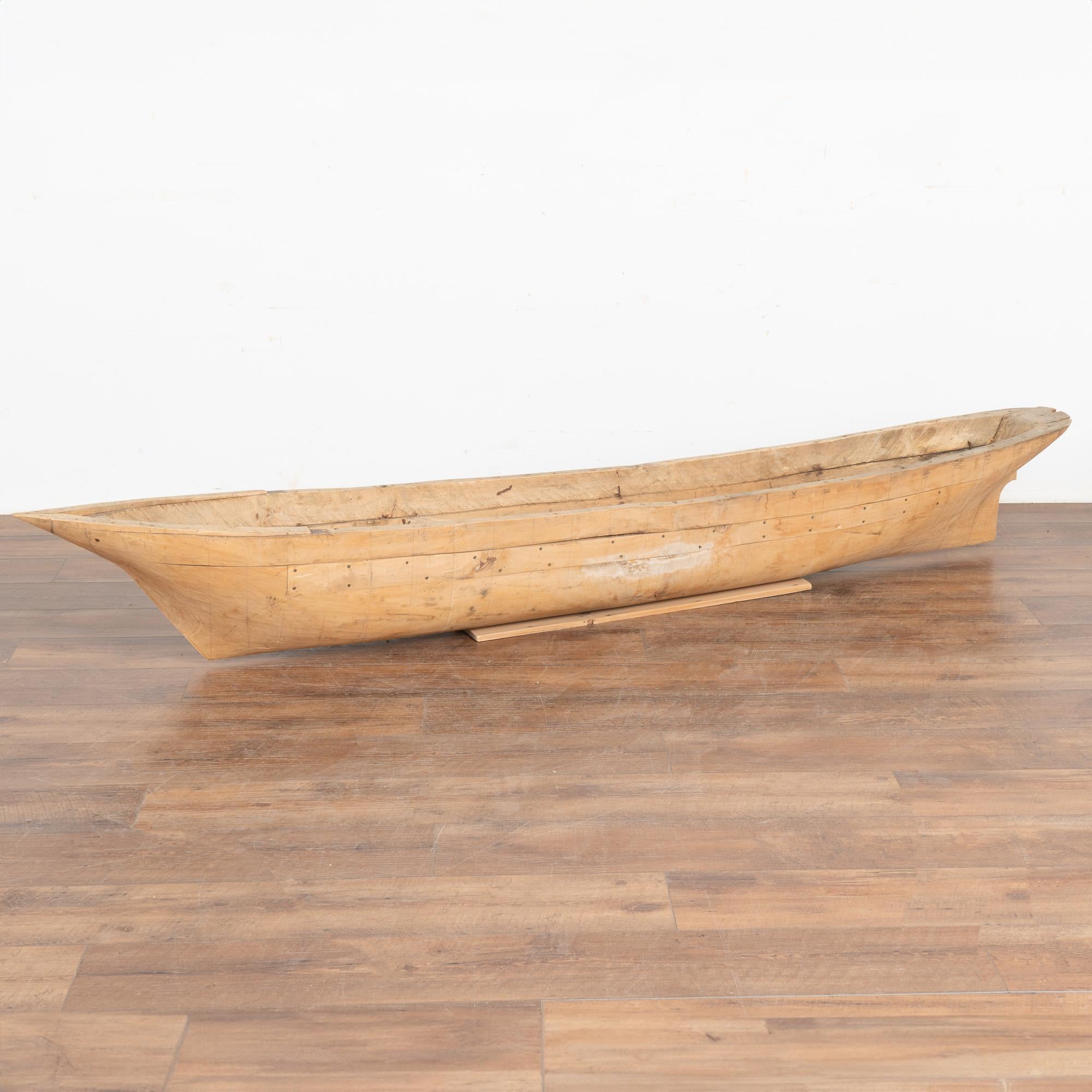 This large model boat was crafted in Denmark in the 1900's. At 7.5' long, the large size makes it a unique decorative statement piece.
Note the hand-hewn elements, sections screwed together, pencil grafting, etc that all combine to create the