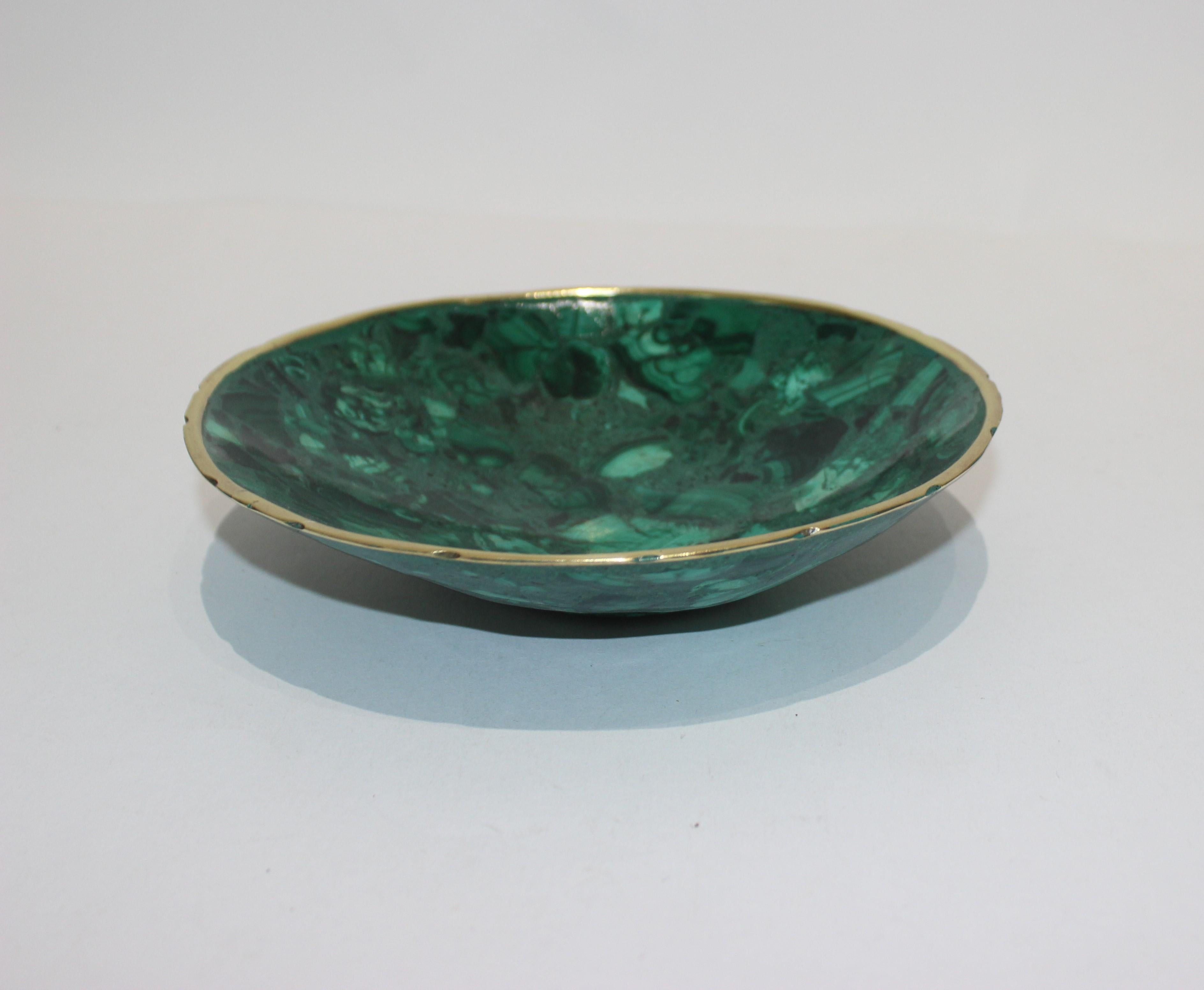 Handcrafted Malachite bowl with scalloped brass edging from a Palm Beach Estate

Note: the last picture shows the bowl in a staged setting -- only the bowl is for sale in this listing...