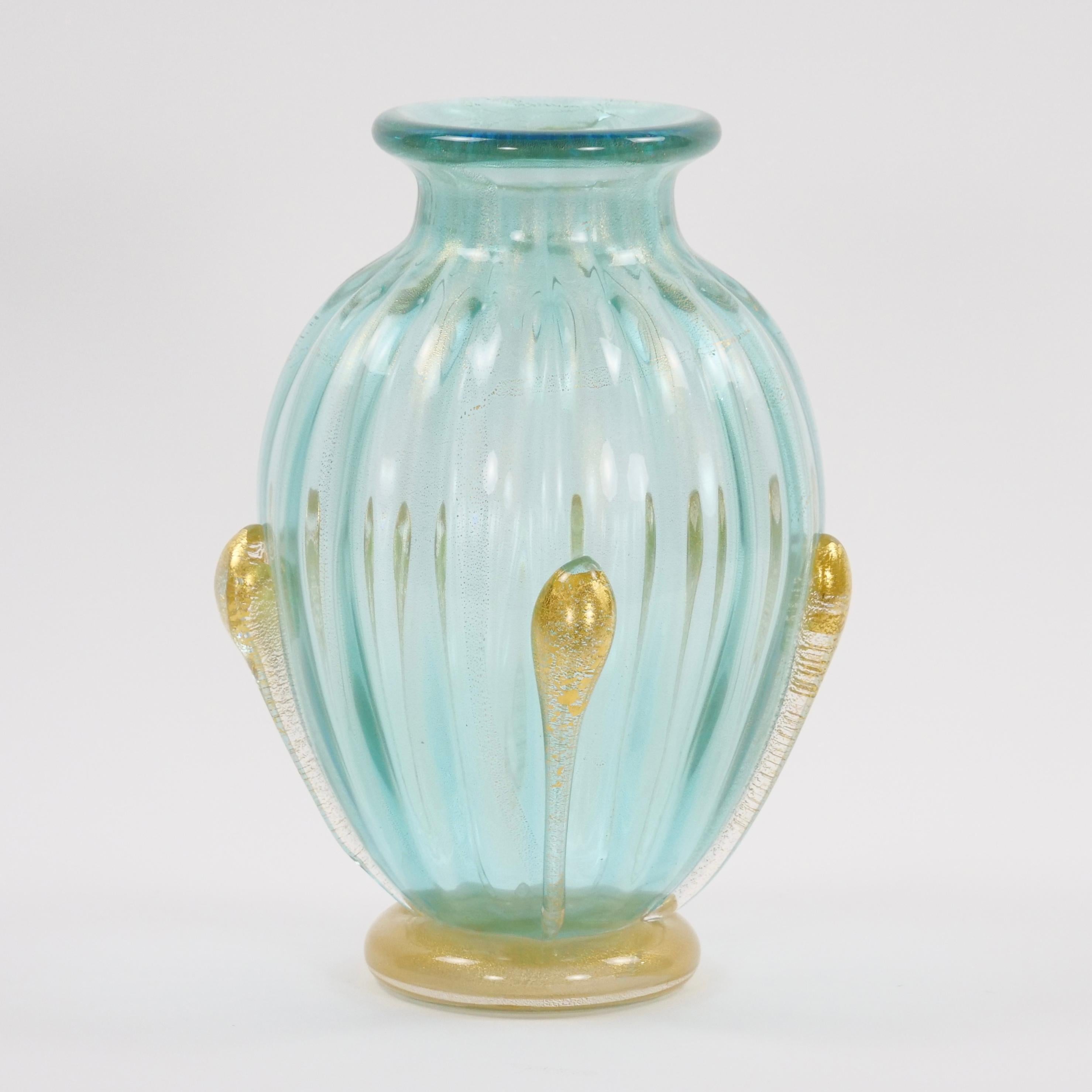 Elevate your space with the enchanting allure of a hand-crafted, mouth-blown Venetian glass vase adorned with exquisite gold flecks. This masterpiece, signed by the artist, encapsulates the legacy of Venetian glassmaking, a tradition steeped in
