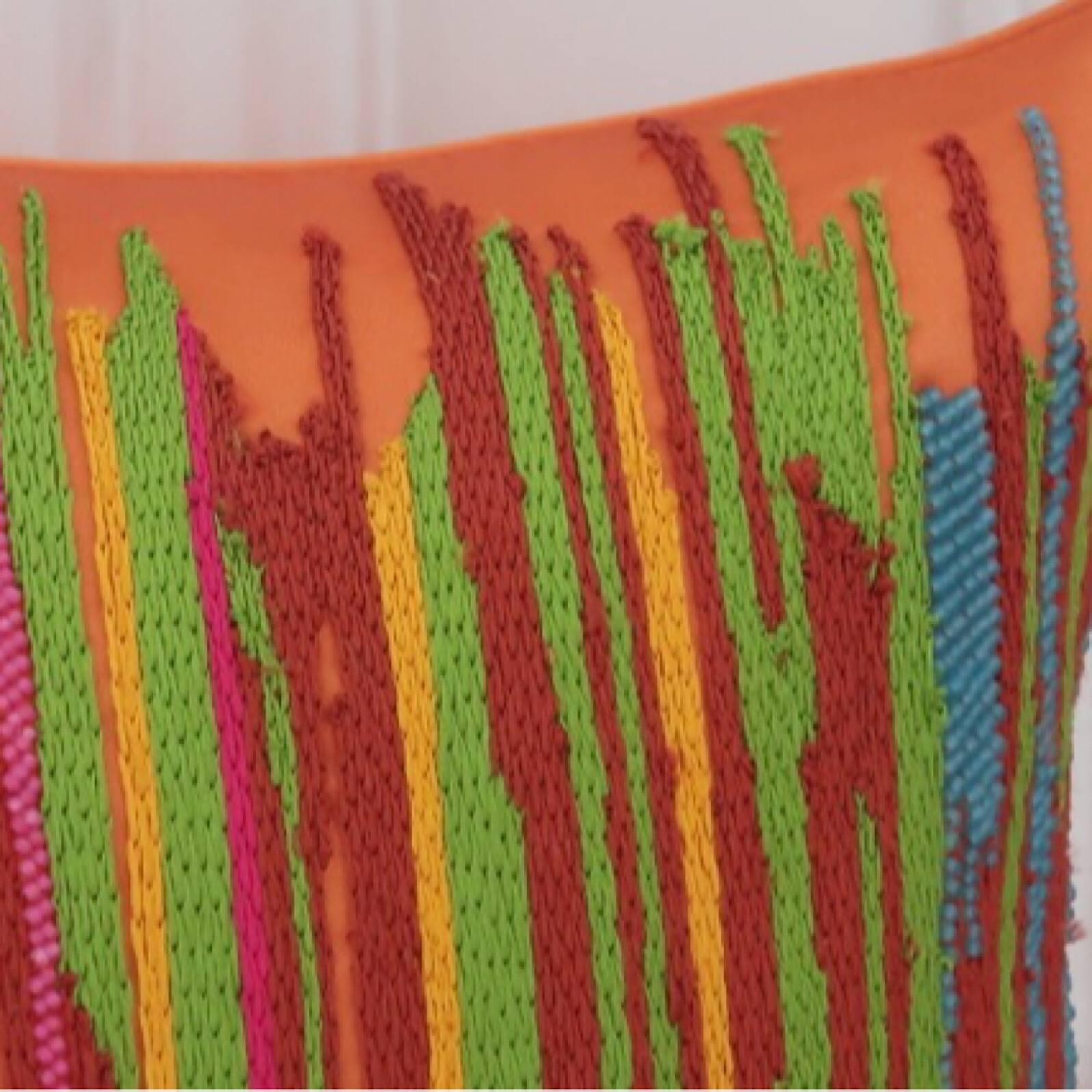 Hand embroidered pillow.
Handcrafted using Matt beads and cotton yarn embroidered in brightly colored stripes on a orange background.
Satin fabric, self zip and feather pads.