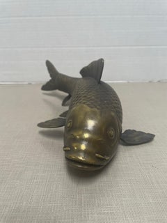 Hand crafted solid bronze Japanese Koi fish. Signed