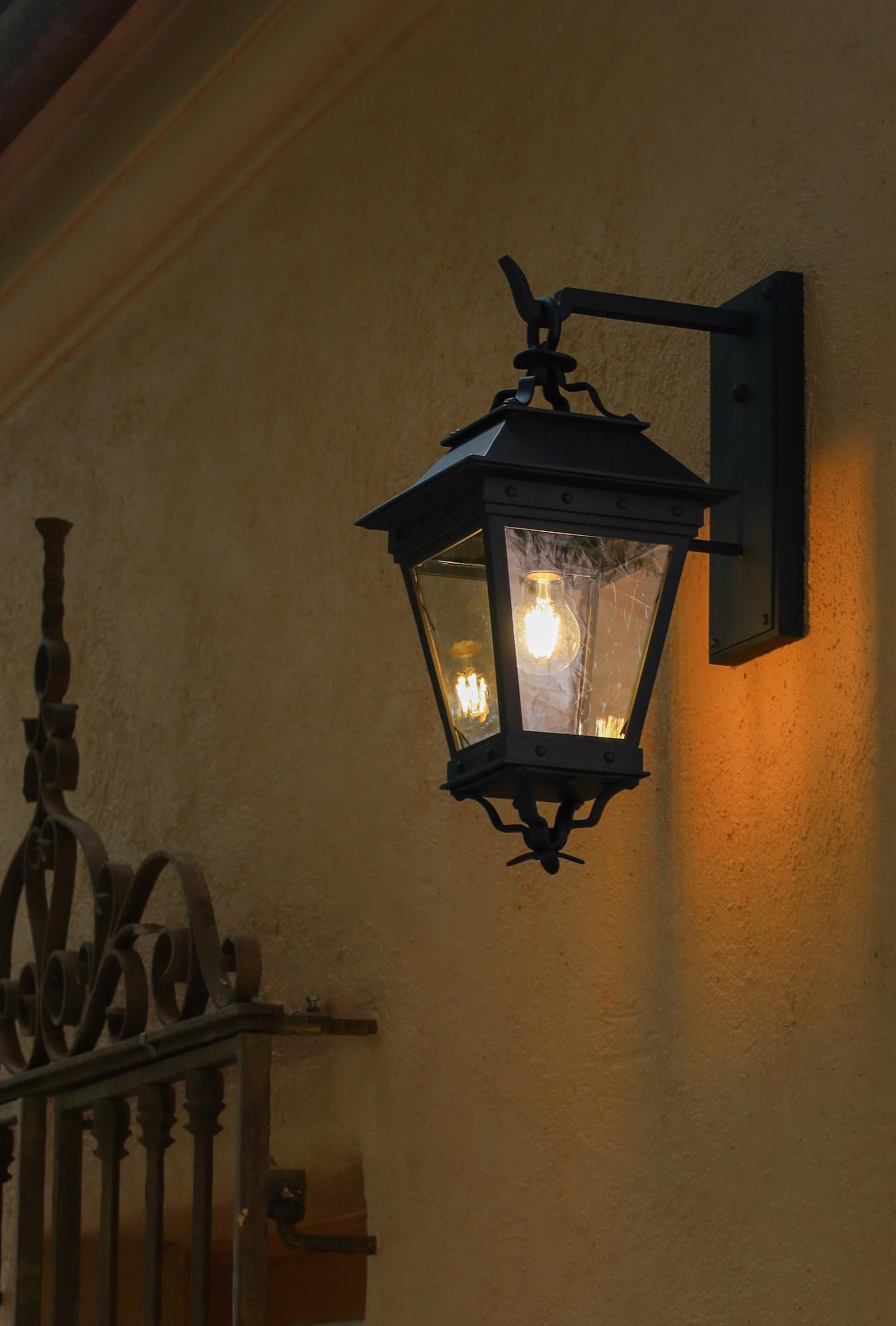 American Hand-Crafted Spanish Style Wrought Iron Ornamental Exterior Outdoor Wall Lantern For Sale