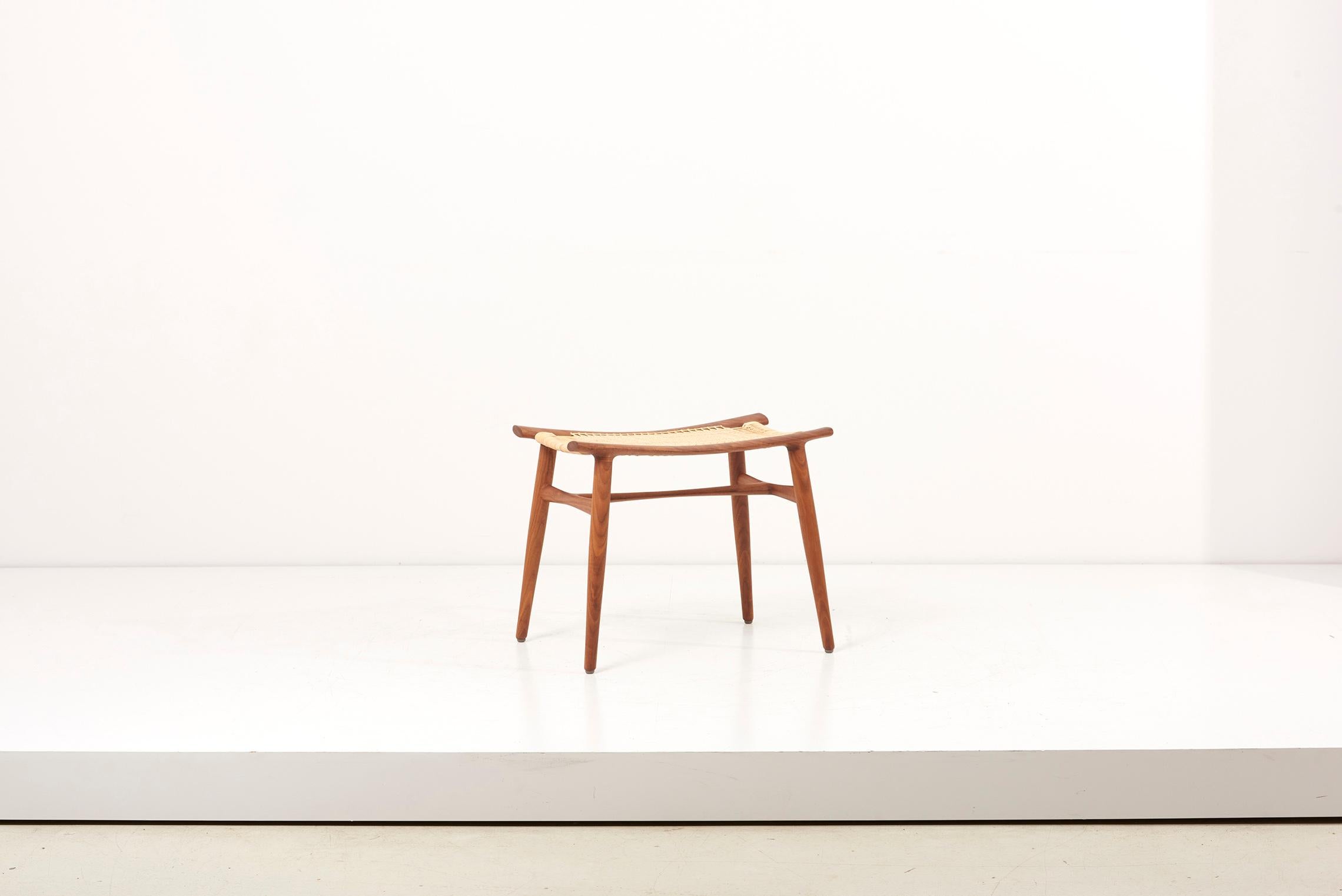 Hand-crafted stool by Japanese designer Hokuto Sekine. The legs and frame are made in walnut while the seat consists of high-quality rattan.