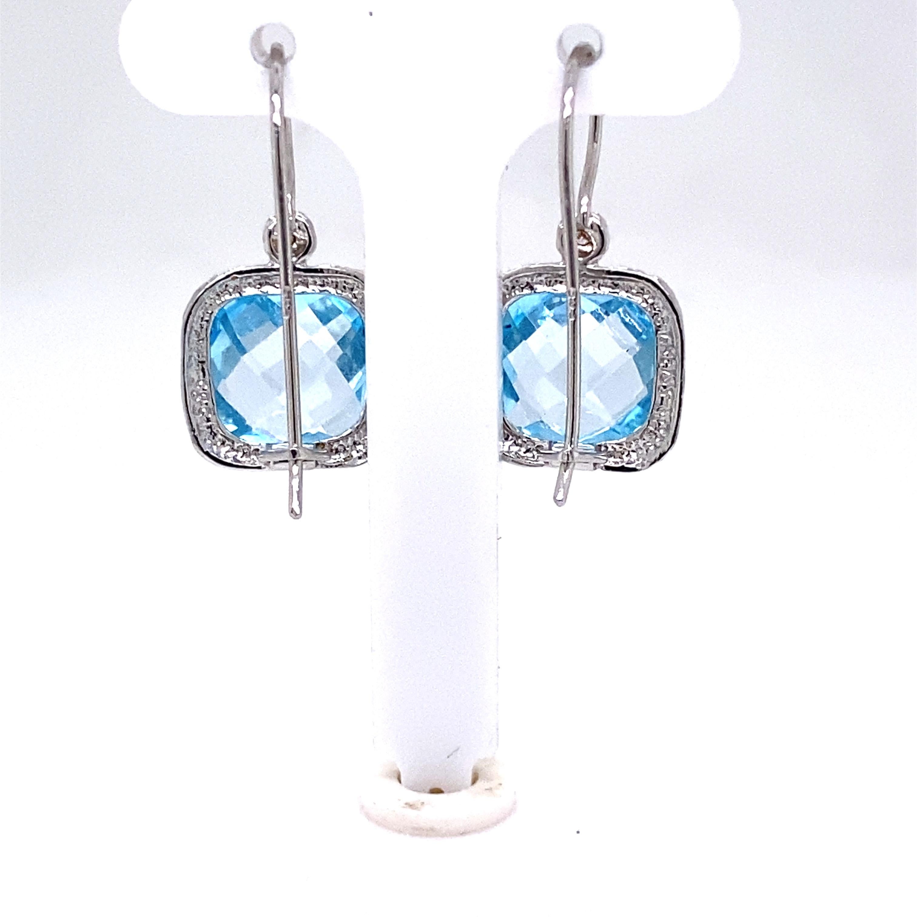 14 Karat White Gold Hand-Crafted Polish-Finished 10mm Checkerboard-Cut Cushion-Shaped Blue Topaz Semi-Precious Color Stone Drop Earrings, Accented with 0.04 Carats of Bezel Set Diamonds.
