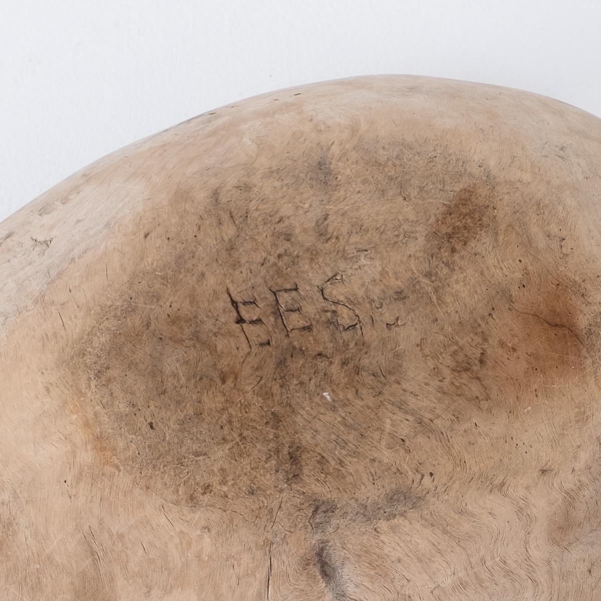 An exceptionally beautiful hand carved wooden dough bowl. Hand built and name carved underside. Late 17th- early 18th century, England. Some faint watermarks present, blending into general patina.