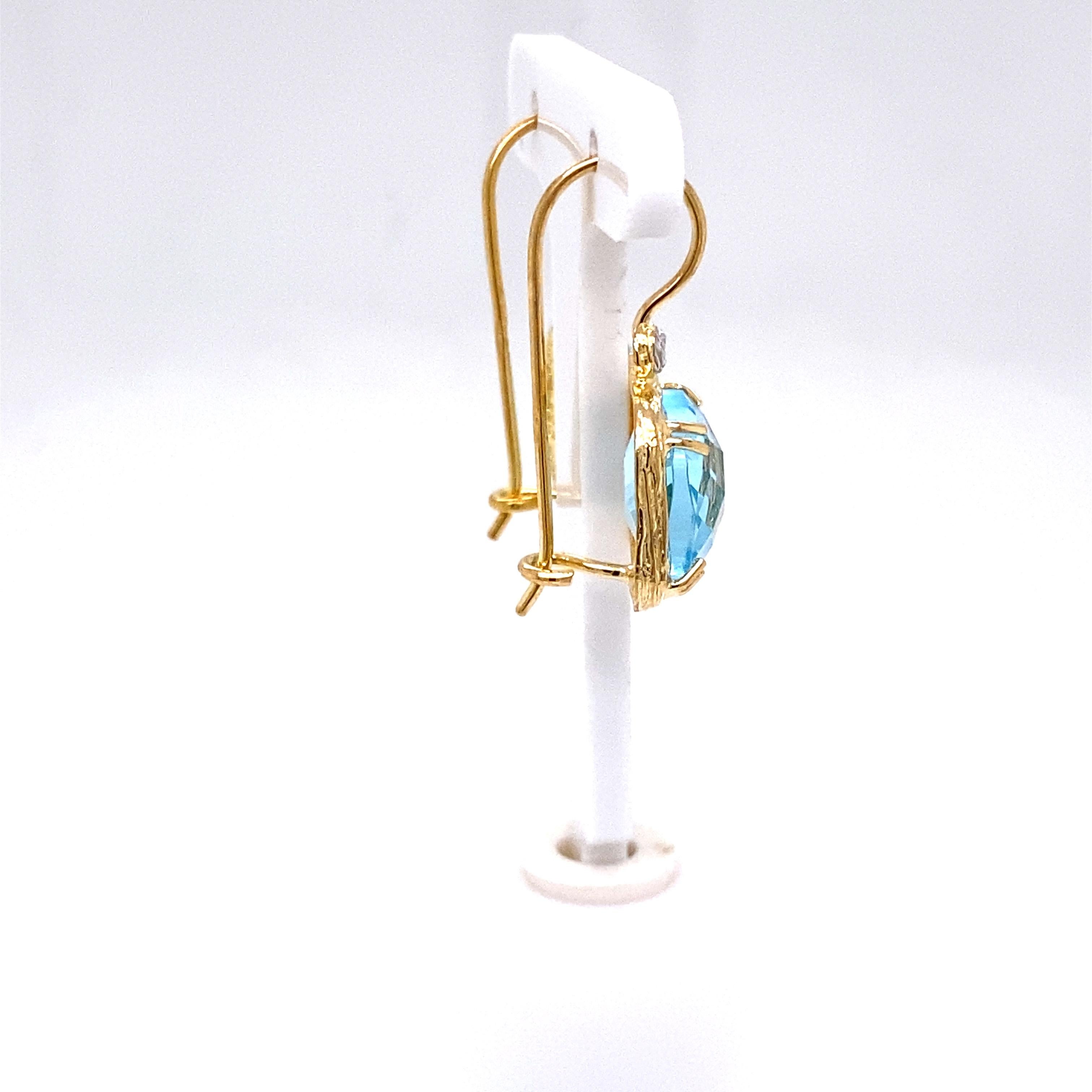 14 Karat Yellow Gold Hand-Crafted Polish-Finished 10mm Checkerboard-Cut Cushion-Shaped Blue Topaz Semi-Precious Color Stone Drop Earrings, Accented with 0.04 Carats of Bezel Set Diamonds.
